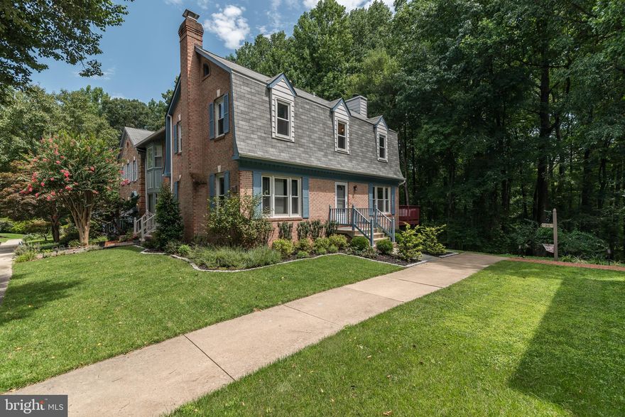 It was nice before and now even better.  Large end unit that looks and feels like a single family detached house.  Many upgrades throughout, including recessed lights, ceiling fans, stainless steel appliances, crown molding, window shades, deck, patio, paint, bathrooms, everywhere.
     Location is very convenient for commuters, yet tucked away in the woods with tree-lined streets.  The cul-de-sac location offers a large parking lot where every townhome has two reserved spaces, and a large island of trees in the middle of the cul-de-sac, providing additional space and privacy.  An uncommon setting where large and spacious townhomes are nestled in the woods, with walkout basements, backing to woods and trails for hiking, walking, bike riding, or just plain viewing.  
     No overstatement here, when you can enjoy your morning coffee or breakfast on your private deck, overlooking the wooded parkland, and enjoy the same for dinner or any occasion.  A great location for entertaining, with plenty of space and parking.   
     Lots of finished square footage, finished level walkout basement, extra room and kitchen in lower level also.  Built-in office desk or home office on upper level, built-in FiOs, HDMI, ethernet, cable wires, USB ports. Accent molding throughout.  Custom shades and blinds, Private setting backs to woods and miles of parkland, and hiking and biking trails.  Quiet setting with plenty of reserved parking (spaces 29 and 30), and visitors parking.  A truly move-in ready property with wooded privacy.