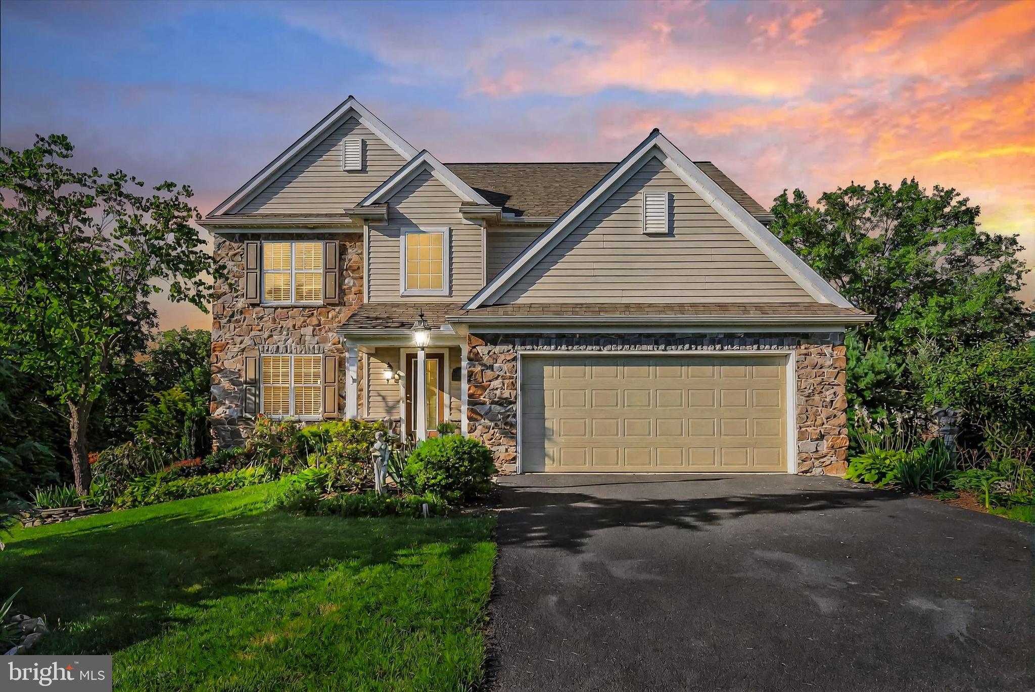 This meticulously maintained, move-in ready home is tucked away in the sought-after Village Glen neighborhood—a quiet community with no through street, offering a peaceful setting and a true sense of connection. Located in the highly regarded Central Dauphin School District, this Stoltzfus-built beauty has been thoughtfully customized and lovingly cared for inside and out.
The exterior boasts artistically designed perennial landscaping and ever-blooming gardens that create stunning curb appeal year-round. Step inside to discover upgraded luxury vinyl plank flooring throughout the first and lower levels, complemented by fresh paint throughout the entire home in 2024. New carpet enhances the comfort of the living room, stairs, and the fourth bedroom.
The spacious eat-in kitchen is a true highlight, featuring a granite island, a huge pantry, and premium KitchenAid appliances—including a double oven and convection microwave. The inviting living room is accented with crown molding, a stone-faced gas fireplace, and a beadboard feature wall, perfect for cozy gatherings.
Upstairs, you’ll find four generously sized bedrooms, including a luxurious primary suite with two large custom walk-in closets. The convenience of second-floor laundry makes daily routines a breeze.
The lower level is designed for entertaining with a bonus rec room, stone-faced gas fireplace, and a stunning walnut live edge bar with a sink and built-in mini refrigerator (which stays). A large unfinished section offers ideal storage or the potential for even more finished living space. From here, sliding doors lead out to a lower patio complete with a granite bar—an ideal spot for outdoor entertaining.
Additional features include custom blinds throughout and an oversized garage that provides ample storage and functionality. More photos COMING SOON—this one won’t last!