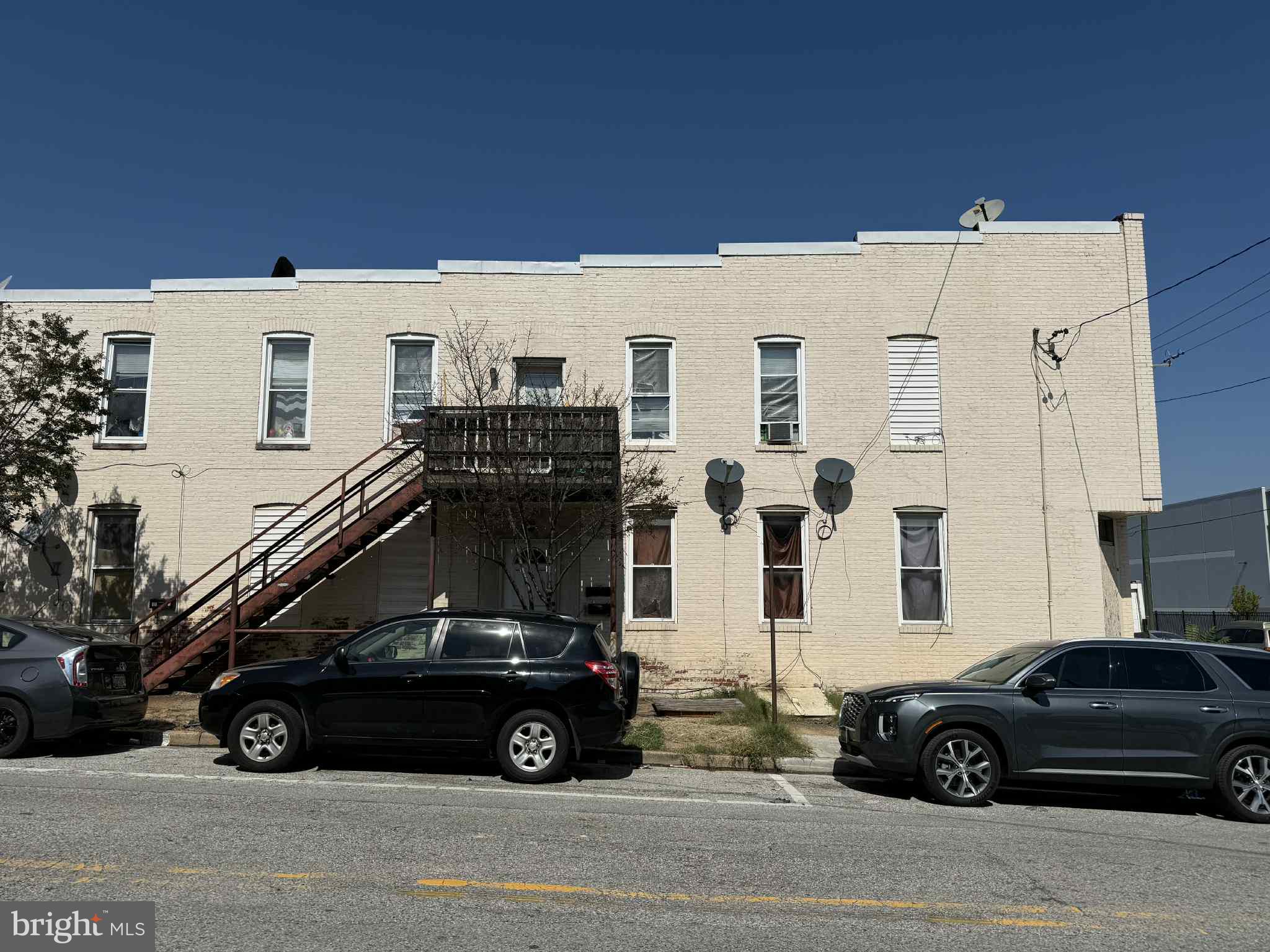 Fantastic investment opportunity across from the new Amazon facility! This corner property is zoned C2, offering flexibility for residential rentals or potential commercial use. Currently configured as three separate rental units with a large unfinished basement that could be converted into an additional unit.