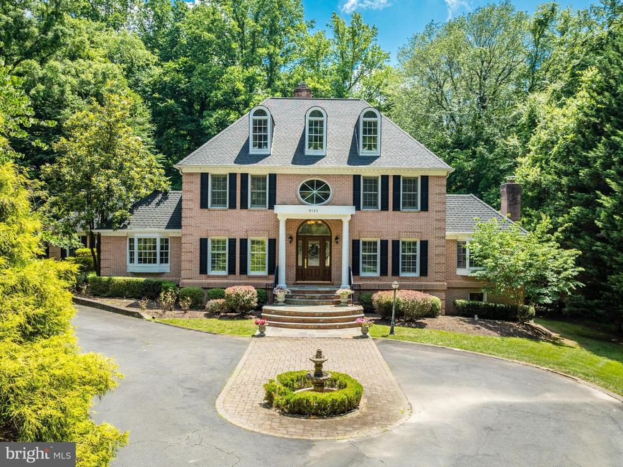 Introducing 9123 Maria Avenue, a stately brick colonial in the heart of Great Falls, Virginia! Situated on a private acre with easy access to Great Falls Park through the cul-de-sac, this impressive property offers professionally landscaped grounds, extensive hardscaping and a dream backyard pool. Vacation at home with a 2-level trex deck and slate patio backing to trees.

Inside, you are greeted by a 2-story foyer with an elegant curved staircase. Many upgrades throughout include hardwood floors, extensive molding and trim, built-ins and more. You're going to fall in love with the spacious layout - perfect for family time and entertaining alike. A separate dining room and private wood-accented office cater to more formal gatherings while the eat-in kitchen is ideal for more casual family time. Off the kitchen is a cozy 2-story family room with a floor to ceiling stone mantel fireplace. Enjoy a three-season room with charming brick exposed wall, a vaulted ceiling and skylights - the perfect place for respite. The main level is rounded out with a formal living room, half bath, and a main-level primary suite which features a custom walk-in closet and spa-like bath. 3 generous bedrooms in the main house upstairs and a bonus media room on the 4th level is the perfect place for kids to play! The finished walk-out lower level includes a full bath and offers additional living space. A wet-bar is perfect for a billiards/rec room while off the living area can offer as an optional bedroom. 

Enjoy a three-car attached garage with a full suite upstairs. Vaulted ceilings, charming dormer windows, and a full bath make this the perfect space to use for an au-pair, in-laws, or to host friends or family from out of town. Plenty of storage space throughout the property, including a shed. The roof was recently replaced in 2020! Located in the desirable Langley High School pyramid and minutes to Tysons Corner, I-495 and the GW Parkway, this is true lifestyle property in the heart of Great Falls. Welcome home!
