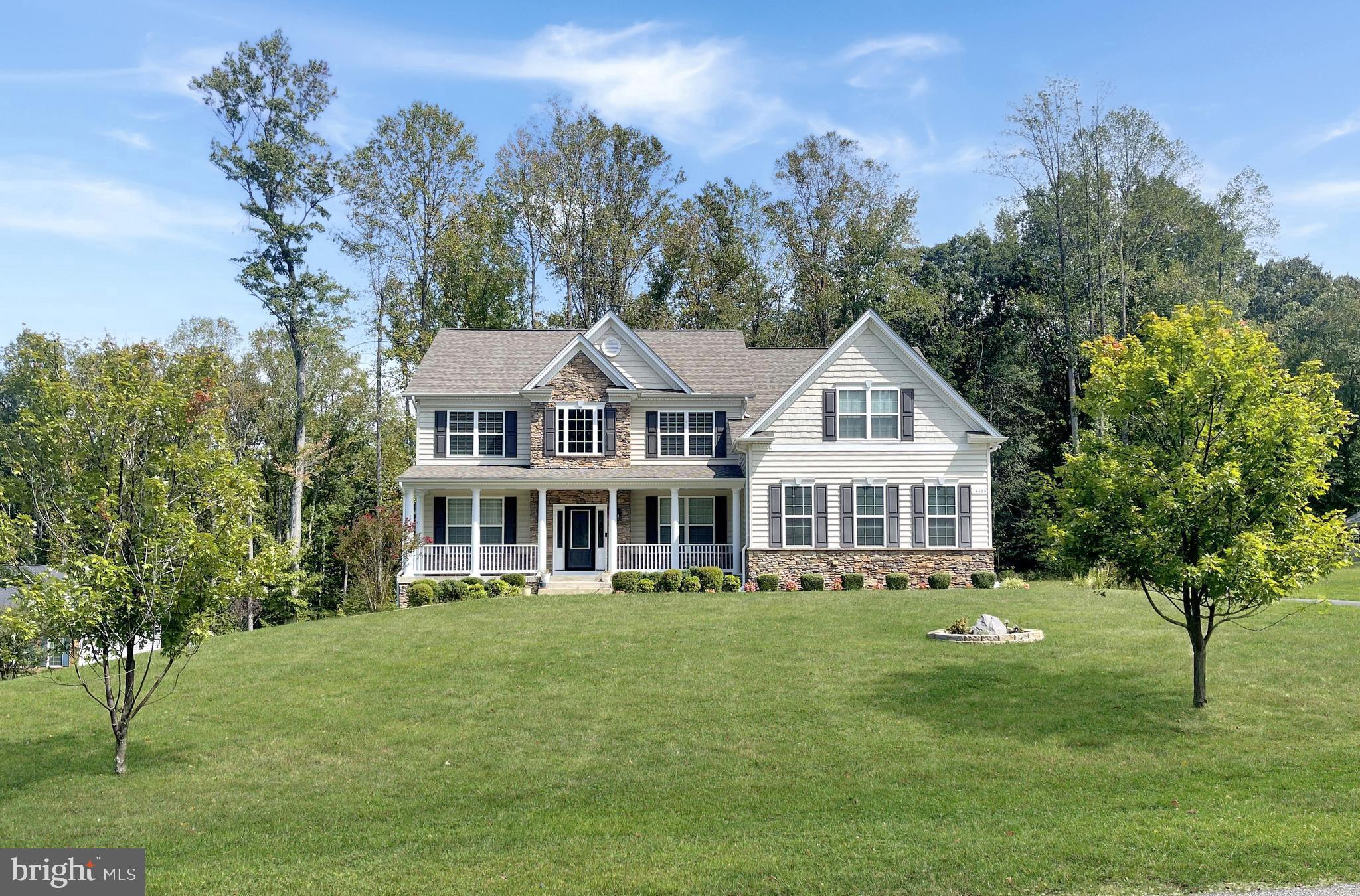 Seller offering $10,000 closing cost assistance with Full-Price offer, VA assumable loan available.
Welcome to this Hampton model by Quality Built Homes, completed in 2019 and thoughtfully designed with nearly 6,000 square feet of finished living space. Perfectly positioned on 1.4 acres in Waldorf’s Turtle Creek, this residence blends elegance, comfort, and functionality.
A dramatic two-story family room with floor-to-ceiling windows and a gas fireplace sets the tone for the main level. The gourmet kitchen is a true centerpiece—featuring granite counters, a large center island, Energy Star GE appliances including double wall ovens and gas cooktop, wine/beverage fridge, and custom tile backsplash. A formal dining room, versatile study/extra bedroom, and hardwood flooring throughout the main living areas elevate the sense of style.
Retreat upstairs to a spacious primary suite with a sitting area, custom shelved walk-in closet, and a spa-inspired en-suite bath offering an oversized shower and soaking tub. Three additional bedrooms, full bath, and an upper-level laundry room complete the private wing.
The finished walkout basement extends the living space with another full bath, custom bar area, and direct access to the back yard is ideal for entertaining or multi-generational living. Step outside to your private, tree-lined backyard with a large deck off the main living area, storage shed and bonus child's play area.
Additional highlights include a 2.5 car side-entry garage, Energy Star systems, and quality finishes throughout. With its refined details and generous spaces, this home offers the perfect balance of luxury and everyday livability.
