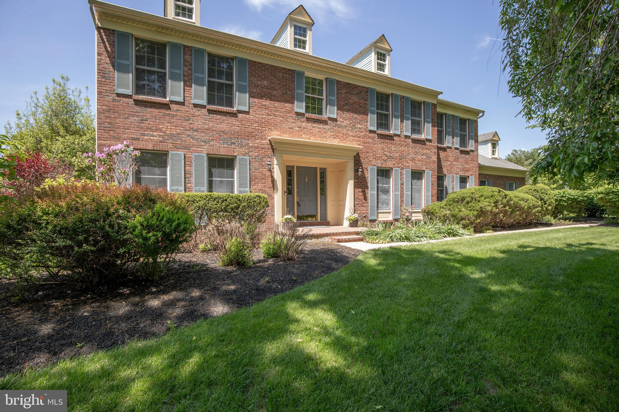 Buckingham Chase neighborhood, brick front Colonial offers spacious room sizes, abundant natural light and a well-designed floor plan. Enter into the two-story foyer with hardwood floors and in true center hall Colonial style, the living room is located on the left and the dining room is located on the right. Travel back to the generously sized family room, and you’ll find a wood burning fireplace, French doors to the living room, triple windows and a window seat overlooking the backyard, plus a door to the paver patio (a great entertaining area too!). The eat in kitchen is the heart of the home and has recently been updated with generous cabinet space, granite countertops, stainless appliances, an island with seating and pendant lighting, tile flooring, a pantry closet, an organizer desk and a spacious eat-in area with a valuted ceiling, that offers patio doors to the paver patio. A home office is tucked away from the fray of the main living space as well as the laundry room and half bath. Abundant closets on this floor make for lots of storage space! Traveling to the second floor, you’ll find a spacious primary suite with an attached primary bath that offers a double sink vanity, shower, soaking tub as well as another sink in the alcove before the bathroom, an oversized walk-in closet and a linen closet that’s also accessible from the hall. Bedroom two is along the back of the home and overlooks the backyard. Bedroom three is the back corner bedroom overlooking the backyard and has a closet organizer system. Bedroom four is the front corner bedroom and has a closet organizer system and overlooks the front yard. A hall bath is conveniently located in between the bedrooms. The room sizes and closet sizes are generous! Going back downstairs to the lower level, you’ll find a finished basement and a storage/utility room. The finished space has been used as a playroom, tv room, gaming area and exercise studio and offers a clean-up sink as well as a wall of closets allowing for great storage. The unfinished utility room offers more storage and a space for the utilities all in one spot. The outdoor area is really special with specimen plantings and lovely landscaping cultivated over the years. Enjoy entertaining on the sizeable paver patio no matter the weather with a lovely awning extending your time outside. The home is situated on a corner lot on over one and a half acres so there’s plenty of room for yard games, sports playing, more gardens or pitch a tent and stargaze. You could create an oasis if outdoor living is your jam! All this and less than a mile from Doylestown Boro! Experience the “Best Small Town Cultural Scene'' and take advantage of the central location to nationally recognized Doylestown Hospital, the county Court House, award winning Central Bucks School District (High School-CB East, Middle School-Holicong, Elementary School-Linden) and the many museums, restaurants, cultural events, commuter roads and trains/rails. You're not just buying a home, you're buying a Lifestyle!