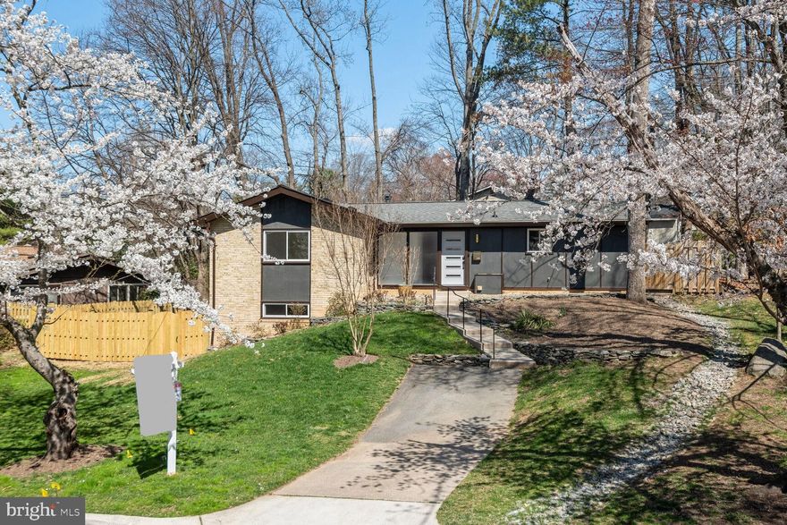 Embrace the epitome of modern living in this meticulously renovated, light filled property in Manor Woods! This stunning property has undergone a complete renovation, preserving its original allure while integrating modern amenities seamlessly. Located in the sought-after community of Rockville, this residence offers a perfect blend of comfort, style, and functionality. Enjoy the lifestyle by joining Manor Woods Swim Club, just down the street, for a sun filled summer.

This home has undergone an extensive renovation, seamlessly blending original charm with modern amenities for the ultimate in comfort and style. With an open floor plan, experience a seamless flow between living spaces, perfect for entertaining or everyday living. Step onto the back patio from the kitchen and dining space to enjoy a tree lined yard for privacy. The upgraded fireplace adds warmth and elegance to the living space. Newly installed waterproof luxury vinyl plank flooring throughout the home combines style with durability. New appliances throughout, including a Frigidaire refrigerator and LG washer/dryer.

State-of-the-Art Electrical Upgrade: Enjoy peace of mind with a 220 Heavy Up electrical upgrade from the street, along with a new meter and electrical panel featuring Arch Protect Breakers. New electrical wiring throughout the house ensures safety and reliability. Benefit from new plumbing throughout the entire house, including upgraded copper water lines and PVC drains, ensuring efficient water flow and longevity. New HVAC with smart technology was installed as well. Stay comfortable year-round with a new HVAC system, including indoor and outdoor units, complemented by a Nest thermostat for convenient climate control. A new Ring doorbell adds an extra layer of security and convenience. The stylish upgrades also include new windows, entrance doors with digital locks, and refreshed external light fixtures. The roof was upgraded to 4-Star Landmark Architectural Roof for long-lasting durability. The landscaping and fresh exterior paint enhance the curb appeal, creating an inviting atmosphere. 

Don't miss the opportunity to call this exceptional property home!