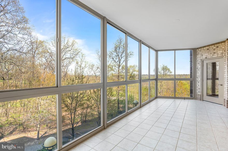 Welcome to Unit 219, an updated 2 bed/2 bath + den condo in the highly desired 55+ community of Lansdowne Woods! This lovely condo invites you in with gleaming hardwood floors that flow seamlessly throughout the space, creating a warm and sophisticated ambiance. Freshly painted, this home has a lovely bright eat-in kitchen, complete with timeless white cabinetry, sleek granite countertops, and plenty of space to whip up your favorite meals. Imagine sipping your morning coffee here as the day begins.

Step into the spacious sunroom—your personal retreat—boasting serene views of lush landscaping and the nearby Lansdowne Resort. Whether you're curling up with a good book or entertaining friends, this space is sure to become your favorite spot in the home.

The owner’s retreat is truly a haven, boasting not one but two spacious walk-in closets to keep your wardrobe impeccably organized. The en-suite bath offers a touch of luxury with its inviting soaking tub and separate step-in shower—perfect for unwinding after a long day. On the opposite side of the condo, you’ll find a generously sized second bedroom, thoughtfully designed for privacy. It features a sleek glass door that opens directly to the sunroom, creating a seamless connection to natural light and the outdoors.

One unique feature of this highly sought after "Q" floor plan is the spacious laundry room with side by side washer/dryer and plenty of shelving to help with the always needed storage space! If you still need more storage, this unit conveys with an extra storage unit,  Room P-4 Bin 079.

As a resident of Lansdowne Woods, you are rewarded with access to the incredible Lansdowne Woods Clubhouse—a true hub of activity and relaxation. This state-of-the-art facility features a fully equipped fitness center, woodworking shop, ceramics studio, library, billiard room, and an inviting indoor pool perfect for year-round enjoyment, and beautifully designed social spaces where neighbors become friends. From group fitness classes to organized events and activities, the clubhouse fosters a lively, connected lifestyle. Whether you're looking to stay active, unwind, or engage with a welcoming community, this clubhouse has it al