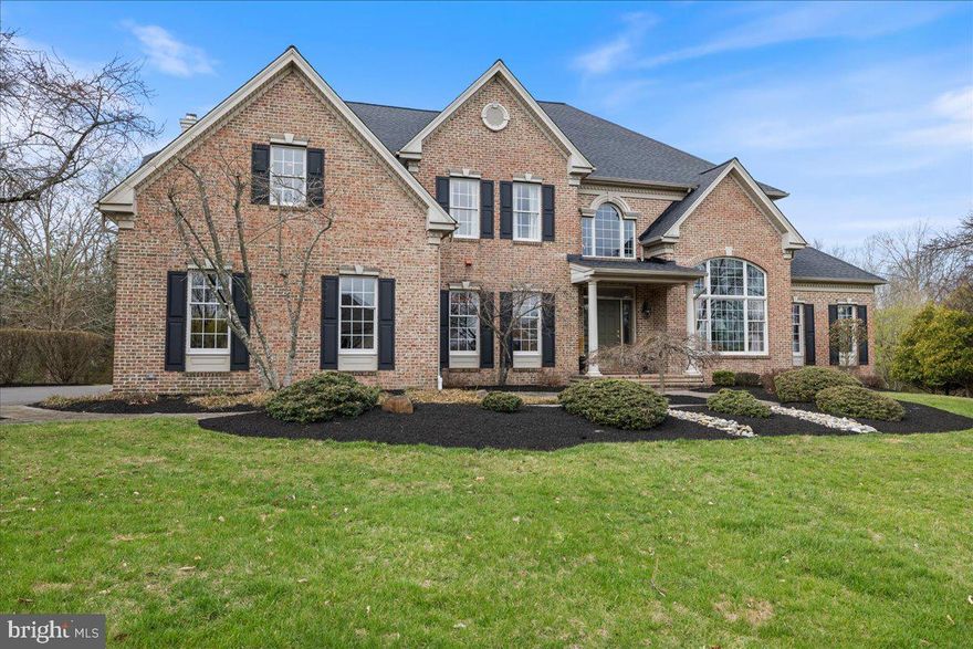 Welcome to this spacious brick Colonial located in the highly desirable Cedar Brook Farm neighborhood. Situated on 1.2 acres, this 4-bedroom, 4-full-bath home offers generous living spaces and exceptional indoor and outdoor areas perfect for entertaining.
A welcoming two-story foyer opens to a bright living room on the right and a private office on the left. The living room features floor-to-ceiling built-in shelving and abundant natural light. Just beyond the living room is a stunning conservatory surrounded by windows and custom shelving—an ideal space for a grand piano, home office, or additional lounge area. The living room flows seamlessly into the formal dining room, which comfortably accommodates a large dining table for gatherings.
The kitchen offers 42” cabinetry, ample counter space, and a center island with bar-height seating for casual meals. A secondary staircase nearby provides convenient access to the second floor. The adjoining breakfast area opens to the family room, where coffered ceilings and a wood burning fireplace create a warm and inviting atmosphere. A wall of new Anderson doors leads to the outdoor patio, filling the space with natural light. Just off the family room is a charming sunroom—perfect for relaxing or reading—with direct access to the patio. Completing the first floor is a newly renovated full bathroom with a walk-in shower and a laundry room that leads to the three-car garage.
Upstairs, the home continues to impress with spacious, light-filled bedrooms. The primary suite features a sitting room that can serve as a workout space, nursery, or home office, along with a large walk-in closet offering ample storage. The primary bathroom has been updated with new countertops and a refreshed shower. On the opposite side of the second floor is a large bedroom with a built-in window seat, shelving, two generous closets, and a private ensuite bath with tub and shower. Two additional well-sized bedrooms and a hall bath complete the upper level.
The full unfinished basement offers 9-foot ceilings and walk-out doors leading directly to the pool area, providing endless possibilities for future finishing.
Outdoors, the property is designed for relaxation and entertaining with a fenced backyard, in-ground pool, and a beautiful two-tier patio that backs to 25 acres of preserved land.
Located in the award-winning Council Rock School District, this home is conveniently close to major highways, shopping, dining, hospitals, and parks. Additional highlights include a newly installed roof (March 2026), Anderson patio doors (2026), built-in sprinkler system, surround sound throughout house, and a two-zone HVAC system.