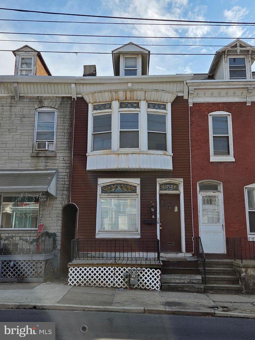 Welcome to 1712 Perkiomen Ave in Southeast Reading—where space, character, and opportunity come together! This spacious home features a large living room and formal dining room highlighted by beautiful original hardwood floors, creating a warm and inviting atmosphere. The elongated kitchen offers ample room for meal prep and everyday functionality, perfect for busy households. Step outside to a generously sized backyard, ideal for entertaining, which leads to a large detached garage—making off-street parking easy and convenient.
Upstairs, you’ll find three comfortable bedrooms and the main bathroom, including a front bedroom that stands out with three oversized bay windows, filling the space with natural light. The third floor offers a fourth bedroom, providing additional room for a growing household, guests, or a home office. With efficient gas heat and hot water, this home blends comfort with practicality. Don’t miss your chance to explore all the potential this property has to offer—schedule your private tour today!