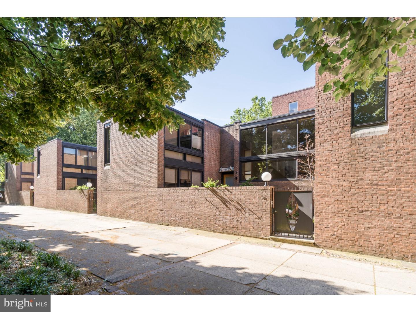 This I.M. Pei masterpiece located in Bingham Court with one-car parking offers multiple levels of open space and high ceilings. The kitchen, with den and dining area, has been beautifully updated and opens into the garden patio off of the main courtyard. The living room offers amazing ceiling height, large windows, and a fireplace. The master bedroom includes updated bathroom and additional bedroom/office. The lower levels include: powder room, family room / library, bedroom suite with updated bathroom, utilities and ample storage. A true Society Hill gem!
