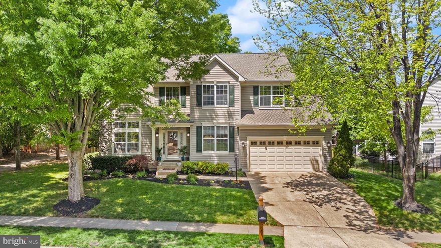 Welcome to this stunning, meticulously maintained home filled with upgrades and thoughtful details throughout! Natural light floods the open floor plan, complemented by fresh paint, upgraded lighting fixtures, and elegant crown molding on the main level. The gourmet kitchen is a chef’s dream, featuring designer stainless steel appliances, quartz and granite countertops (2023), a stylish backsplash (2023), and hardwood stairs with a custom banister (2023). Relax in the inviting family room showcasing a beautiful fireplace with a custom feature wall. Upstairs, the primary suite offers a spa-like bathroom updated in 2020, complete with heated tile floors, a wall towel warmer, a rain head shower, and a 6-ft soaking tub. Upgraded closets add both style and storage throughout the home. The finished walk-up basement is ideal for guests, an in-law suite or rental unit, featuring new carpet (2025), durable LVP flooring (2020), a kitchenette, and handicap-accessible access.  Outdoor living is equally impressive with a gorgeous screened-in deck adorned with café lighting, a refurbished patio (2025), a peaceful Zen garden with a fountain, and an outdoor kitchen with a natural gas grill, burner, and bar—perfect for hosting.  Fresh landscaping, landscape lighting, a fire pit, and an in-ground sprinkler system complete the backyard oasis, fully fenced and backing to serene woods.  Additional features include a 2-car garage with epoxy flooring and custom storage, new HVAC (2021), new roof (2023), new washer and dryer (2024), and a Honeywell humidifier. This is a truly move-in ready home that offers luxury, comfort, and privacy — don’t miss it!