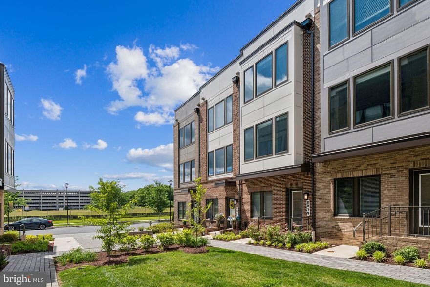Welcome to 8037 Baxter Street, a beautifully designed 3-bedroom, 3.5-bathroom townhouse located in the sought-after Westside at Shady Grove community in Derwood, Maryland. Built in 2021, this contemporary home offers over 1,600 square feet of thoughtfully designed living space across three levels. Highlights include an open-concept floor plan filled with natural light, a gourmet kitchen with stainless steel appliances, granite countertops, and a spacious island, as well as a private balcony for outdoor relaxation. The home also features an attached garage for added convenience. Residents enjoy access to a clubhouse with a fitness center and pool, as well as nearby walking trails, parks, and playgrounds. Ideally situated just steps from the Shady Grove Metro Station and minutes from major commuter routes including I-270, I-370, and the ICC, this home blends comfort, style, and convenience in one exceptional package.