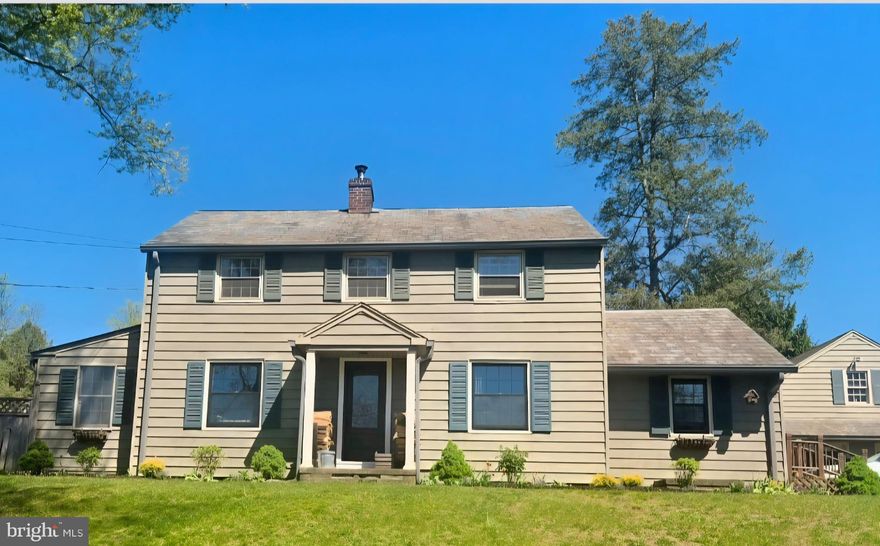 If you’ve been looking for something with space, light, and a little personality, this one stands out. Set on 1.5  acres in Doylestown Township, this 3-bedroom home is anything but cookie-cutter.   Wide Width siding and a real slate roof  adorn the exterior of the home.   Inside, you’ll find hardwood floors, solid craftsmanship, and a layout that just feels good to live in. The home is filled with natural sunlight, and the rear great room is a true highlight—open, bright, and lined with windows that look out over the backyard and peaceful surroundings. It’s the kind of space you’ll naturally gather in, whether it’s a quiet morning or a full house.     
The kitchen has a classic Bucks County feel, featuring a skylight, updated appliances, and a Mercer tile backsplash that adds just the right touch of character. There’s also a formal dining room with a built-in corner cabinets, a cozy living room centered on a  woodstove, and a side sunroom  perfect for a home office or sitting room.  French doors that lead out to a bluestone terrace add to the charm of this space.
Upstairs, the bedrooms are comfortably sized, including a primary with two closets. A newly updated bathroom with a custom vanity and contemporary tiled shower.   A new heater and hot water heater, means security for years to come.  
Outside, the setting really shines. The yard is open and usable, with a stone patio, fenced area for pets, and plenty of room to enjoy the outdoors.    The first floor windows have been replaced.    The detached two-car garage has a full second floor ready for whatever you need—art studio, gym, workshop, or just great storage.
Close to everything you need, but with a setting that feels like a retreat, this is a home that offers space, sunlight, and something a little different from the usual.