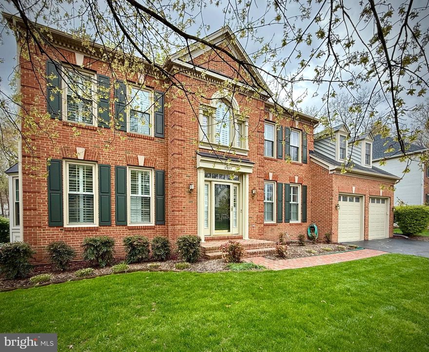 Welcome to Ashburton Manor, a distinguished and highly sought-after enclave located in the vibrant heart of Herndon. This impeccably maintained beautiful redbrick residence, quietly positioned near the end of a private residential street,  sits on a professionally landscaped lot adorned with mature trees and a brick patio—offering unmatched seclusion and curb appeal. Spanning over 4,000 square feet of living space, this upgraded home blends modern finishes with timeless comfort and a spacious two-car garage and private driveway completes the package. Inside, you're welcomed by a dramatic double-height foyer that leads to an elegant front sitting room, a charming dining area perfect for entertaining, and a refined executive office. The centerpiece of the home is the family room, featuring hardwood floors, an eye-catching wood-burning fireplace, and tall windows with plantation shutters with french doors accessing a spacious sunroom.  The enclosed sunroom is a true highlight, featuring vaulted ceilings and skylights that fill the space with natural light—perfect for relaxing or entertaining. For those who enjoy outdoor living, step down to the charming brick patio, where serene wooded views and a cozy fire pit create an ideal setting for evenings under the stars. Finishing off the ground floor,  a well equipped kitchen offers a perfect space for cooking and gathering, and there is also a powder room. The upper level features a luxurious primary suite complete with a cozy sitting area, soaring vaulted ceilings, and a generous walk-in closet. The fully renovated en-suite bathroom is spacious and stylish, showcasing dual vanities, a freestanding soaking tub, and an expansive walk-in shower. The second bedroom offers ample storage and includes its own beautifully updated en-suite bath. Two additional bedrooms share a recently refreshed full bathroom, providing both style and convenience for family or guests. The walkout lower level offers generous ceiling heights and a large recreation room—ideal for movie nights or entertaining. This level also includes a full bathroom, and flexible utility room that can serve as storage or a workshop. Living in Herndon offers the perfect fusion of suburban charm and modern convenience. Situated in a prime location, residents enjoy access to scenic parks and trails, upscale shopping and dining, and a welcoming neighborhood ambiance. Excellent connectivity via major highways and public transit ensures easy commutes to Washington D.C. and beyond—making Herndon an ideal retreat for those who value luxury, comfort, and accessibility.