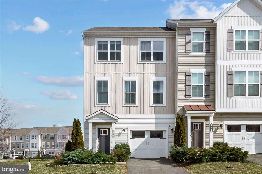 Step inside this spacious 2,550 sq. ft. end-unit townhome, perfectly situated on a large corner lot with a one-car garage and driveway parking. The lower level is designed for entertainment, featuring vinyl flooring, a wet/dry bar with a wine fridge and keg dispenser, and a game room with a conveying pool table. Just outside, a tiled patio provides additional outdoor space, overlooking an open, unfenced yard. The main level offers an open-concept layout with hardwood floors throughout the kitchen, dining, and living areas. A decorative fireplace adds charm, using gel flame canisters for ambience. A half bath is also conveniently located on this level. Upstairs, the spacious primary suite includes a large bedroom and an en-suite bathroom with a large double vanity. Two additional bedrooms, both carpeted, sit side by side and share a tiled full bath. Located near schools, shopping, and just minutes from downtown Fredericksburg’s restaurants and small businesses, this townhome is available immediately. Rent is $2,600 per month, with a $25 pet rent per pet (Max 2) and a $50 application fee per applicant 18+. Apply today!