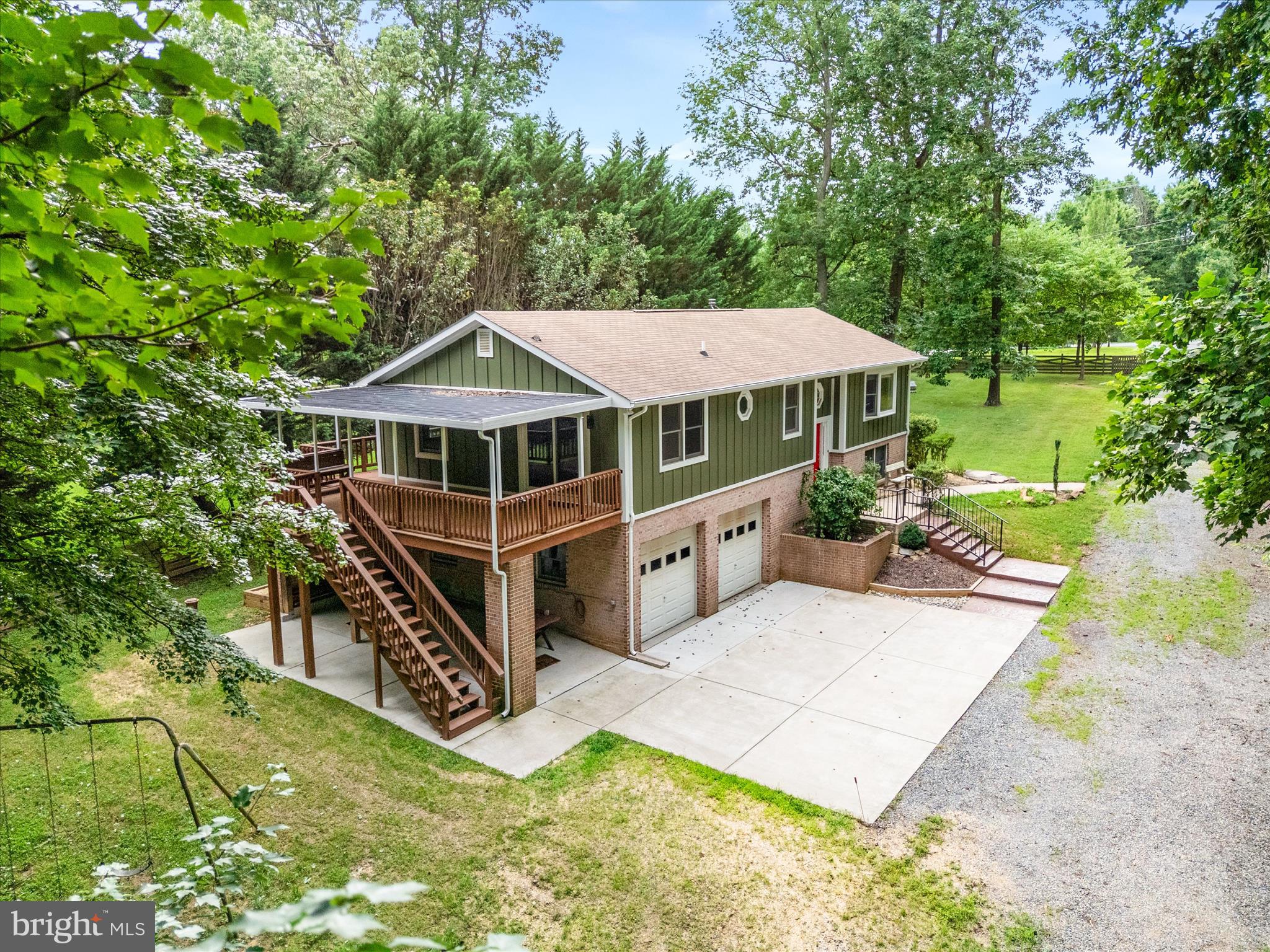 Rare opportunity to own over 7 acres with public sewer in a peaceful, tree-lined neighborhood just 2 miles from Shady Grove Metro. Offering the perfect blend of space, seclusion, and convenience, this 7.05-acre property (per tax record) is zoned RE-1 and may allow for a variety of special uses, including a farmers market, church, residential care facility, construction administration or sales office, landscape contractor, among other potential opportunities (buyer to verify).
A preliminary call with the county confirmed that the lot meets zoning and size requirements for potential subdivision. Buyers are encouraged to explore this possibility further.
This custom Keystone home, originally built in 1991, was renovated between 2024 and 2025. Recent updates include Hardie board and batten siding and new gutters installed in 2024. The architectural shingle roof was replaced around 2010 by the prior owner. A generous deck (approx. 12.5’ x 24’) extends off the primary bedroom and overlooks the wooded property, complete with a new awning (2024) and sliding glass door (2024) for easy indoor-outdoor living.
Out back, you'll find a large shed and a watertight shipping container, ideal for tools, hobbies, or equipment storage. Concrete parking is available directly in front of the two-car garage, with additional covered parking located next to the garage beneath the deck. A gravel driveway leads from the road to the home, while stamped concrete steps add a touch of charm as they guide you to the front entrance.
Inside, the layout is bright and open, with a cathedral ceiling in the family room that flows into the dining area and kitchen. Hardwood floors (Mohawk Oak in Butterscotch finish) run throughout the upper level, and a cast iron wood-burning stove with soapstone detailing adds warmth and character. The kitchen includes a stainless steel refrigerator (2021), dishwasher, range, garbage disposal, and microwave.
Laundry is conveniently located on the main level, with a washer and dryer that are less than a year old. The finished basement includes a rec room, full bath, bonus storage room, and interior access to the two-car garage.
The home uses well water with a filtration system, and the water heater was replaced in 2020.
The current owner maintained a scenic network of dirt bike and UTV trails throughout the property, which can be hiked to the upper section of Rock Creek Regional Park; home to the picturesque 75-acre Lake Needwood, popular for boating, fishing, hiking, and more. With the help of an excavator, the trails were widened to fit side-by-sides, creating the perfect setup for off-roading, dirt biking, or quad adventures right your own property. There are two tributaries on the property that merge at the southeast edge, where they flow into Mill Creek just as it enters Rock Creek Park. Hawks, deer, box turtles, and tree frogs are frequent visitors to this peaceful oasis, offering a front-row seat to nature's beauty. Wildlife photos available upon request. Experience the charm of country living just minutes from the Metro!
With easy access to I-270, MD-355, MD-200/ICC, and I-370, this is a truly rare opportunity to own a large parcel with public sewer, potential subdivision options, and RE-1 zoning benefits. Details about RE-1 zoning and allowable uses are available in the disclosures and on the county’s website. Buyer to verify how wetlands and watershed areas may impact intended use.