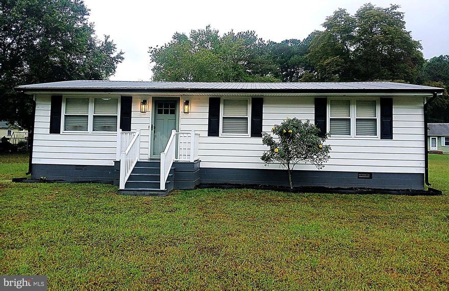 Welcome to 1606 Towson Ave — a beautifully renovated 1,056 sq ft home that blends modern elegance, smart features, and energy efficiency. Situated on nearly half an acre, the home greets you with a brand-new front porch and a bright, open-concept interior featuring LED lighting and luxury vinyl plank flooring throughout. The designer kitchen is a true highlight, offering soft-close
cabinets with upgraded hardware, rollout pantry shelves, quartz countertops, a ceramic tile backsplash, a matte black farmhouse sink, and a sleek two-tone modern faucet. All-new smart kitchen appliances complete the space, making it as functional as it is stylish. The bathroom has been thoughtfully designed with custom ceramic tile, a Kohler soaking tub, a modern vanity, paired with gold and matte black fixtures for a contemporary finish. Comfort and convenience continue with a brand-new HVAC system, a Rheem tankless water heater, full-house water filtration, and smart WiFi lighting controls throughout the home. Located just minutes from The Centre at Salisbury, local parks, the zoo, and with easy access to Route 50 Bypass, this home is also conveniently close to major employers such as TidalHealth, Salisbury University. Offering the perfect balance of style, technology, and location, 1606 Towson Ave is where modern living meets everyday comfort.