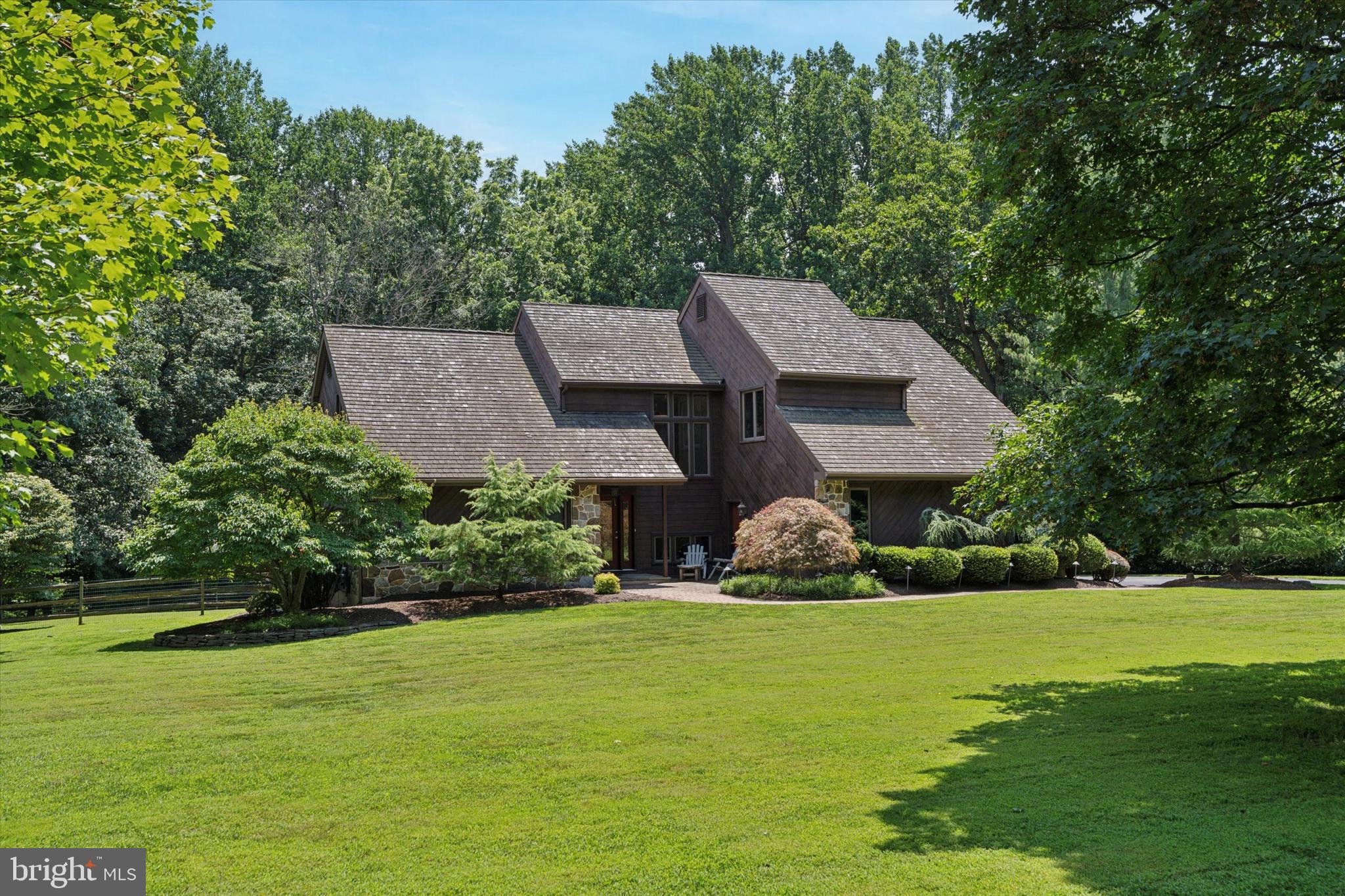 It is rare when you find a home whose address also describes the feeling you get when you spend time there. "Hearts Ease" is the feeling you can expect if you are the next owner of this beautiful property. From its convenient location to the Borough of West Chester activities, the sights and sounds of Philadelphia, to the ease of access to the beaches of NJ and Delaware, you can relax in the knowledge of all the options you have available. In addition, if public schools are a need of yours now or in the future or just for resale value, the Unionville-Chadds Ford school district is unmatched. The home is an exceptional contemporary style which offers great open living spaces and the appropriate private spaces for work and rest. The floor plan grabs you as your first enter the foyer with the natural light provided by the front and rear windows. You are first drawn to the large living/family room with soaring ceilings and skylights. The floor plan offers a great flow for entertaining and everyday living. The Chester County stone fireplace is wood burning and centers your focus. To the right, you have a formal dining room with a large French door access to the deck. Continuing on to the updated kitchen, you will note the custom backsplash, hard surface counters, double sink, newer range and refrigerator. There is a separate breakfast area and a newly installed slider to the deck. Circling back, you will pass the butler's pantry, the first-floor laundry room, garage access and the main level Powder room. The eastern side of the main level offers an additional game room or at-home office with oak built-in cabinetry installed. And the Primary Bedroom is located on the main level and features a tray ceiling with recessed lighting, a gorgeous bathroom with a double bowl vanity and a uniquely tiled walk-in shower. In addition, the large closet with custom shelving is exceptional. The second level of the home starts with an open staircase to an upper balcony with a great view of the living area. Immediately to your left is a separate loft area perfect for a little reading or homework. The second bedroom and ensuite bath is large and features custom shelving in the closet. Across the hall you will find two more large bedrooms with great storage and closets. In addition, the hall bathroom was recently updated, and it is quite beautiful. And as a final "that's awesome", an additional laundry room has been added to the second level. (maybe you can teach your kids or house guests how to do their own laundry?) The lower level is mostly finished and can provide a great space for whatever you might use it for. In addition, there is nice storage for your "stuff" and an access door to the rear yard for safety. A few other highlights to hopefully help ease your heart about purchasing this home. The landscaping and fenced yard is amazing and ready for your pets/kids and your personal touches. The HVAC system was installed in 2020 as well as the water softeners and surge protector. There is a propane fueled generator for emergencies. The septic system has been pre-inspected, and the report is attached. The entire first floor of the home, excluding baths, has had yellow birch hardwood flooring installed in '24. The cul-de-sac street provides a low trafficked area. And if not familiar with the area, you are surrounded by the history that helped form this country. This is a wonderful opportunity for you to make this house, your home!