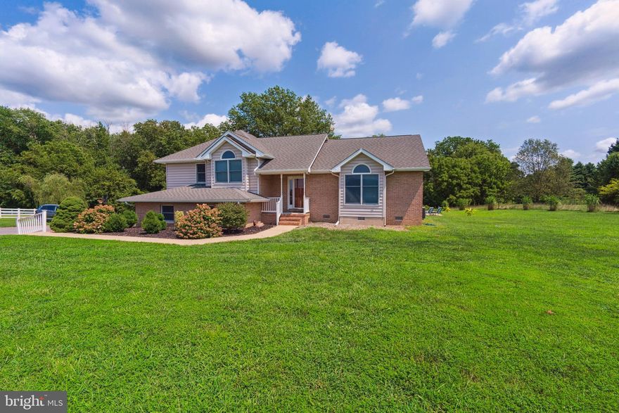 Welcome to this charming three-bedroom, 2 1/2-bathroom home nestled on +/- 1.38 acres, just a stone's throw from the serene Tuckahoe State Park. Set on a private lot that backs to lush woods, this property offers a perfect blend of seclusion and convenience. Just inside you will discover a spacious open floor plan highlighted by beautiful hardwood floors throughout the main level. The inviting Living Room features soaring cathedral ceilings and seamlessly flows into the dining area and kitchen, making it ideal for entertaining. The adjacent Breakfast Room boasts sliding doors that lead to the expansive back deck, perfect for al fresco dining and enjoying the picturesque views of your own in-ground pool. Upstairs, the Primary Bedroom offers a tranquil retreat with an en-suite bathroom and a generous walk-in closet. Two additional guest bedrooms and a full bath complete the upper level. The lower level enhances the home's appeal with a Family Room with gas fireplace, offering direct access to the pool area, and is complemented by a convenient powder room and laundry room. Additional features include a two-car garage and a large driveway. Located in the highly regarded Centreville School district, this home combines modern comforts with a private, nature-filled setting. Ask about the Mid-Shore Love Down Payment Grant which provides a $1000 grant to qualified buyers. Don’t miss the opportunity to make this your own private oasis!