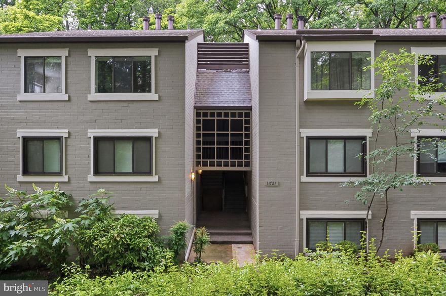This top-floor end-unit, 2-bedroom, 2-bath garden-style condo in Reston’s Springwood community offers the added privacy of having no neighbors above and a peaceful wooded backdrop behind the unit. The covered balcony overlooks mature trees, creating a quiet outdoor space that feels removed from the surrounding buildings and parking areas.
<p>
Inside, the layout gives you defined living spaces while still feeling connected and functional for everyday life. The spacious living room centers around a wood-burning fireplace and opens directly to the balcony through oversized sliding glass doors that bring the wooded view into the main living area. A separate dining area creates flexibility for entertaining, working from home, or everyday meals.
<p>
The kitchen has been updated with granite countertops, stainless steel appliances, recessed lighting, and warm-toned cabinetry. An additional built-in seating and storage area provides extra functionality and casual dining space.
<p>
Both bedrooms are generously sized with large windows that bring in natural light. The primary suite includes its own full bath, while the second bedroom and full hall bath offer flexibility for guests, a home office, or shared living. The large laundry room includes additional storage space alongside the in-unit washer and dryer.
<p>
Fresh paint, freshly cleaned carpeting, and a neutral interior palette create a clean backdrop ready for the next owner’s personal style.
<p>
One reserved parking space (#71).  Unmarked and unnumbered reserved spots are open for residents and guests. 
<p>
Residents enjoy access to Reston Association amenities including pools, tennis and pickleball courts, basketball courts, playgrounds, lakes, and more than 55 miles of trails and pathways throughout Reston. South Lakes Shopping Center, Reston Town Center, Reston Station, and the Silver Line Metro are all just minutes away. Commuting is convenient with quick access to the Dulles Toll Road, Route 7, Route 286, and Dulles International Airport.