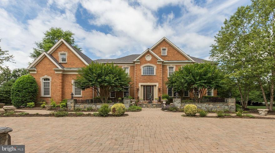 Originally this was the Toll Brothers Model Show House w/every conceivable option added - Sun Room, Music/Conservatory, Two Story Foyer, Two Story Family Room, Main Level Library and more!  Custom details, built-ins throughout.  Exceptional Master Suite with Sitting Rm, Bar, Fireplace and Big Master Bath.  Children's rooms are both Suites w/Bedroom AND separate play/homework room! Fantastic Party-Ready Lower Level w/Big Wet Bar, Rec Room, Wine Cellar, Billiard Room, Home Theater.  Exceptional private entrance Au-Pair/In-Law Suite with separate Living Room/Bar and Bedroom.  Expansive hardscaping outside including a full paver driveway, decorative stone walls and columns, a backyard pergola, recirculating river rock stream bed, gated garage area entrance plus professional landscaping around the entire property.  You can't rebuild this at it's list price.  Come buy today!