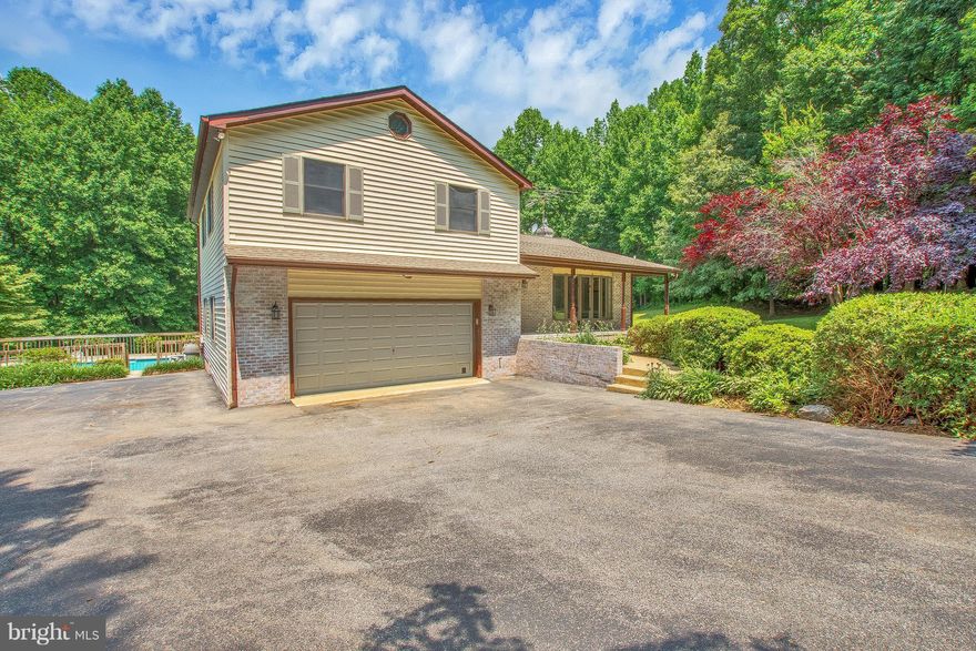 PRIVATE OASIS DESCRIBES THIS SPECTACULAR HOME WITH 4 LEVELS ON 5 ACRES.  FEATURES INCLUDE:  GLEAMING HARDWOOD FLOORS, UPDATED GOURMET KITCHEN, UPDATE BATHS, MUD ROOM W/CUSTOM BUILT BENCH/STORAGE, CUSTOM BOOKSHELVES, SALT WATER GUNITE POOL, CIRCULAR DRIVEWAY, NEW GEOTHERMAL  AND WELL PUMP.  NO HOA!  YOU DON'T WANT TO MISS THIS BEAUTY!!!  MAKE IT YOURS TODAY!