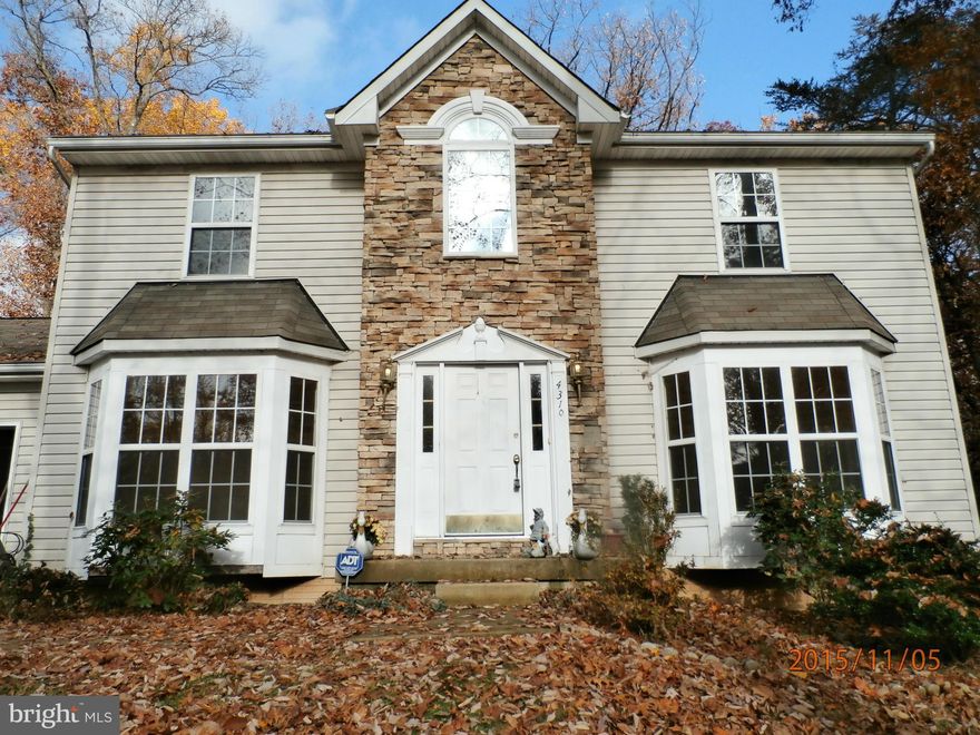 Needs a little TLC. This colonial is tucked away.  Living, Dining and bedrooms are all hardwood.  Large master bath, walkin closet.  Familyroom off kitchen with gas fireplace.  Downstairs is fully finished. Theater room, large laundry. rec room and is walk out level.  Deck, 2 car garage.  Easy access to Rt 26,695. As is Buyer to pay all docs and transfers