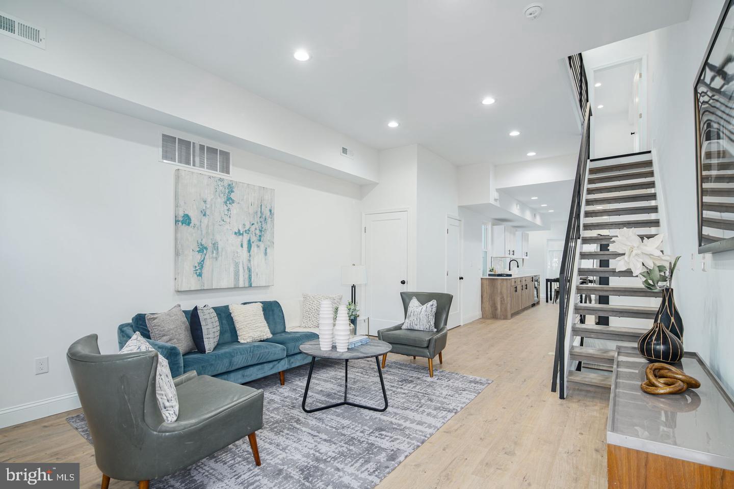 Welcome to 840 Leland Street – Where Style Meets Comfort in the Heart of Francisville! You don't want to miss this stunner with 6+ years of tax abatement (ending in 2032), This impressive 3-bedroom, 2.5-bathroom townhome offers 2,100 sq. ft. of thoughtfully designed living space, including a fully finished basement that can serve as a fourth bedroom, home office, or workout space. Every detail has been carefully curated to blend modern elegance with everyday functionality. Step inside to an open-concept living area with high ceilings and oversized windows flooding the space with natural light. The chef’s kitchen boasts two-toned cabinetry, sleek black fixtures, a custom backsplash, and stainless steel appliances, including a spacious island for prep and gathering. Sliding glass doors lead to your private outdoor patio, perfect for summer nights and weekend brunches. The second floor features two spacious bedrooms with ample walk-in closet space and large windows. A beautifully designed full bathroom ties the space together with black fixtures, a large vanity, and elegant ivory textured tile. The third floor is your personal sanctuary—a primary suite with a walk-through closet and a spa-like ensuite with double vanity, soaking tub, and marble hex tile finishes. And just when you think it couldn’t get better—step onto your private rooftop deck. With prime location and luxury finishes throughout, this home is a rare gem. Schedule your showing today!