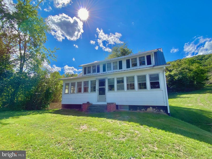 Discover the perfect blend of comfort and adventure with this beautiful Cape Cod home, situated on an impressive 29.67 acres. Featuring four bedrooms, a full bath, and a half bath, this home is designed for easy living and seamless access, being conveniently close to the road for effortless parking.  Connected to an additional pristine 27.77-acre parcel, this property offers a unique opportunity for those seeking both tranquility and outdoor excitement. The additional land boasts a moderate slope, mature timber, and breathtaking views, and it borders the national forest—ideal for hunting and hiking enthusiasts. A cleared electric line on this parcel is ready for a secluded food plot, enhancing your outdoor experience.  Recent upgrades include a newly installed road leading to the mountain's summit, perfect for ATV adventures or hunting. The property is just one mile from the entrance to Smoke Hole Canyon, renowned for some of the best fishing in the state, and less than 10 miles from the Highlands Fisher Mountain Golf Resort for your golfing pleasure.  This property combines the convenience of a well-maintained home with the allure of expansive recreational land. Don’t miss this exceptional opportunity—call today to schedule a private showing and make this mountain retreat yours!