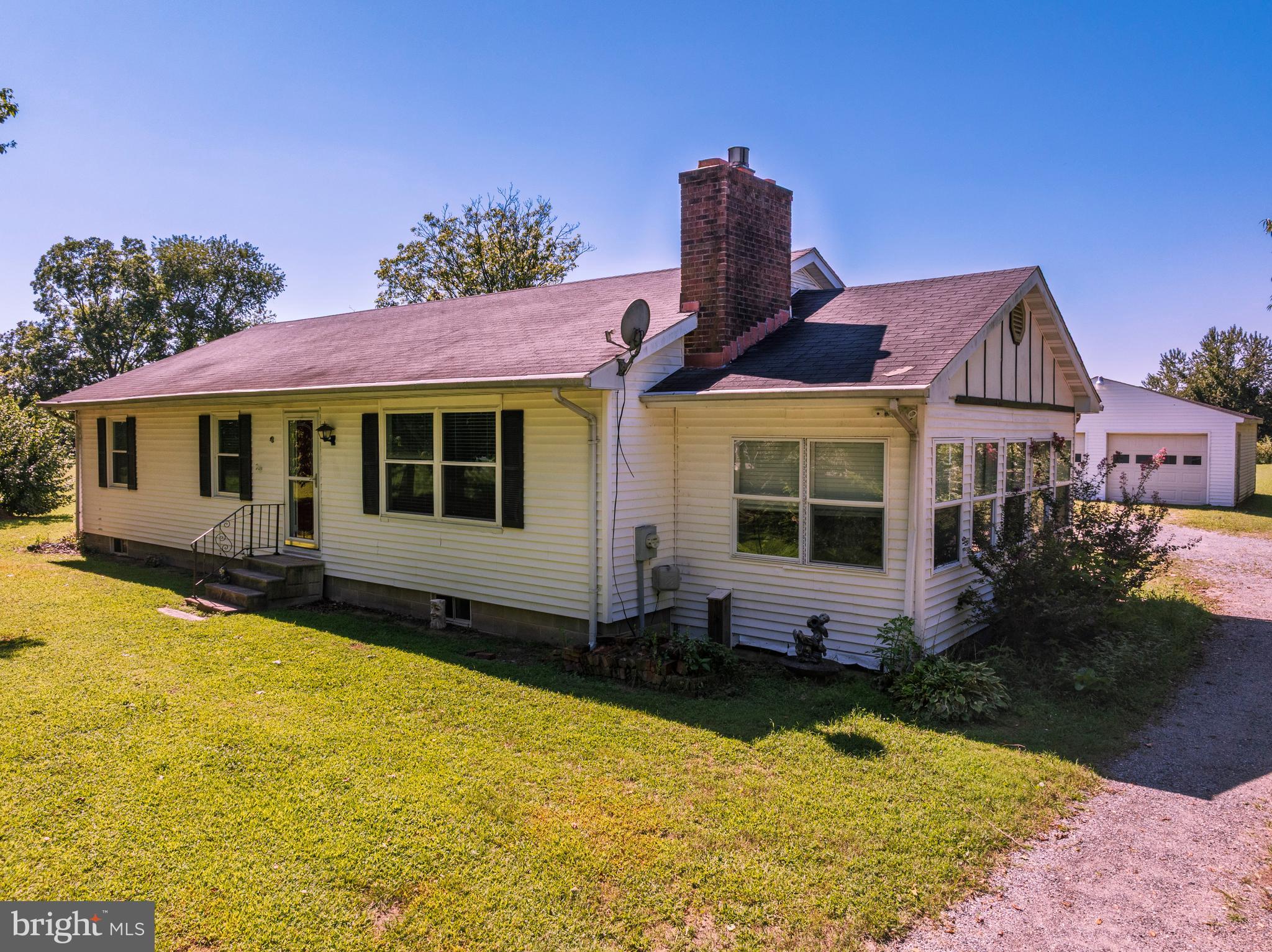 Enjoy peaceful country living in this charming 3-bedroom, 2-bath rancher set on 2.5 acres backing to open farmland. The home welcomes you with a comfortable living room featuring a cozy gas fireplace and a separate dining space just off the kitchen. The kitchen offers newer appliances and opens to an enclosed sun room—a versatile space perfect for an office, playroom, art studio, or home gym.
The primary bedroom includes a remodeled private bath with a walk-in shower, while two additional bedrooms share a conveniently located hall bath. Outside, you’ll find a detached 2-car garage, ideal for vehicles, storage, or stowing your kayaks for quick trips to the nearby Choptank River.
The full unfinished basement has inside access from the kitchen, as well as an outside entry. The basement has been completely framed in for some rooms and a large open family room area. The basement provides another 1344 sqft of space.
With 2.5 acres of open land, the property offers future potential for a pasture, small crops, a pool, or even a barn. Located just minutes from Greensboro and a short drive to Denton for shopping and dining, this home blends country charm with modern convenience.
