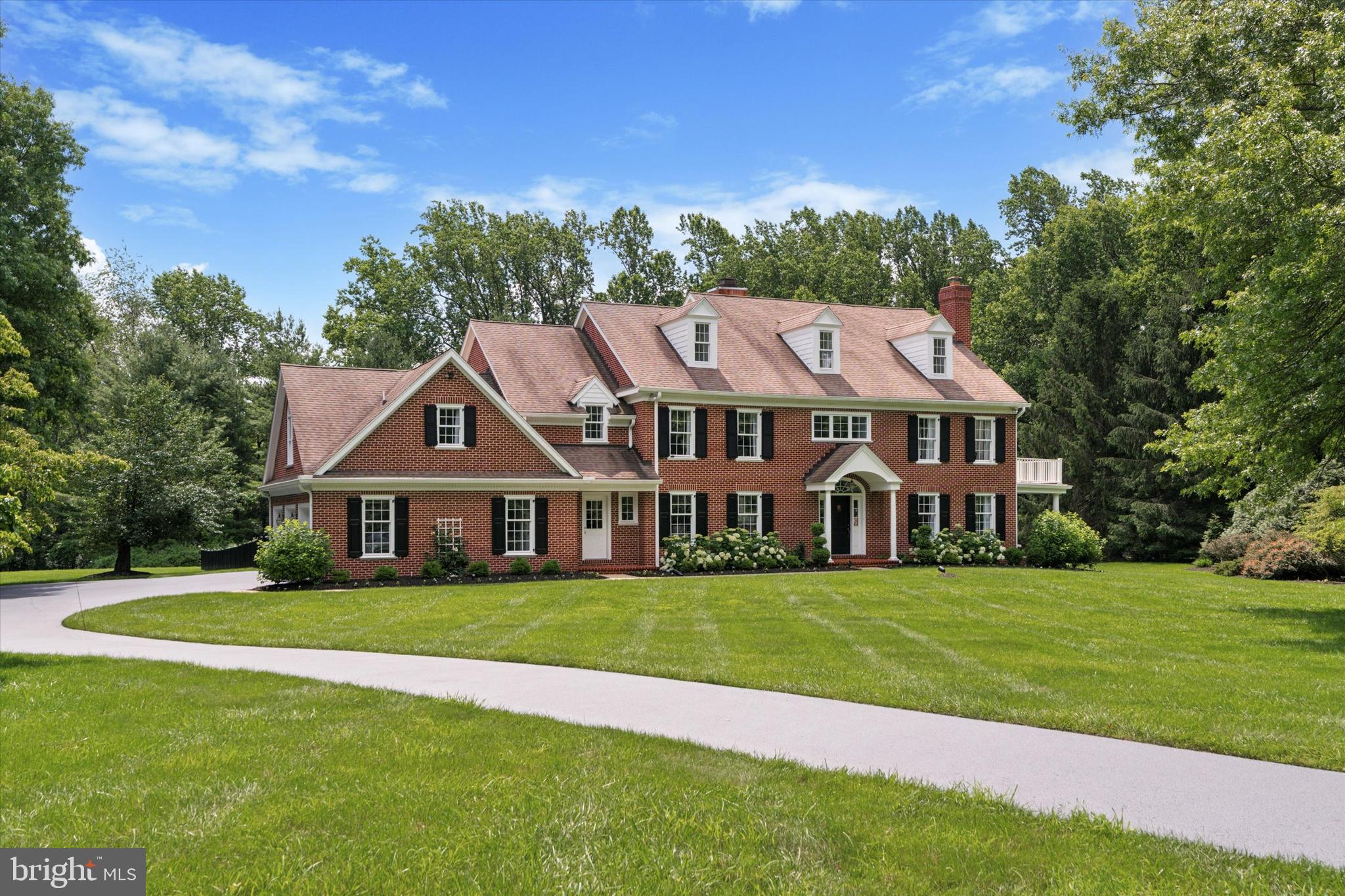 The pool is open. The hydrangeas are in full bloom and the seller is motivated to sell. Just like the iconic sophistication of Tiffany & Co., this exceptional residence exudes timeless luxury and refined charm. Nestled on a quiet cul-de-sac in the Glenwood Estates neighborhood, this stately brick Georgian Manor sits on 2 meticulously landscaped acres and has been fully renovated to the highest standards.
From the newly installed heated inground pool bordered by white hydrangeas, to the reimagined interior blending classic design with modern touches, every detail has been thoughtfully curated. Step into the grand two-story marble foyer and immediately sense the craftsmanship that defines this home. Rich hardwood floors, both new and refinished, flow through the formal living room with coffered ceilings, the private office/den, and the vaulted family room complete with a striking chandelier, fireplace, and built-in bar.
The heart of the home is the stunningly renovated chef’s kitchen, featuring premium appliances and a dramatic 2-inch thick marble center island. Adjacent, a redesigned laundry/utility room with powder room provides convenient access to the attached garage.
Upstairs, wide-plank hardwood floors lead to a serene primary suite with a private staircase to a versatile loft space—ideal for a studio, reading nook, or additional office. The luxurious primary bathroom is a true retreat, while each of the three additional bedrooms boasts its own beautifully appointed en-suite bath.
Solid brick construction, intricate dental molding, and a walkout basement with bonus room showcase the home’s quality and attention to detail. Outdoor spaces have been reimagined with new paver patios, refreshed garden beds, and an expansive, revitalized yard designed for both beauty and ease of maintenance.
The best part? You're purchasing a classically built Georgian Colonial with all the character of an established home—yet with the fresh, turn-key feel of new construction. No renovations needed, just move in and enjoy a lifestyle of understated elegance.