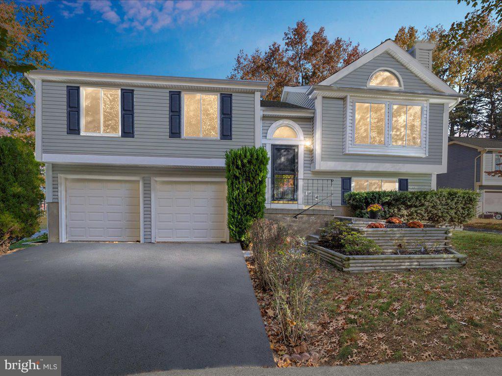 Welcome to this beautiful move-in ready modern 2-story home in Hanover, Maryland, located in Anne Arundel County and priced at $549,900. This spacious home features 5 bedrooms, 3 full bathrooms, a 2-car garage, and a fully fenced backyard—perfect for comfortable and flexible living.
Inside, you’ll find a stylish blueish-grey interior with tall ceilings in the upstairs living room, creating a bright and airy feel. The kitchen and living room are located on the upper level, offering a unique and open layout ideal for entertaining and everyday living. The kitchen includes plenty of cabinet space and flows directly into the dining and living areas.
Each bedroom offers generous space, and the primary suite includes two separate closets with plenty of storage and a private full bathroom.
The fully fenced backyard is great for pets, gatherings, or enjoying outdoor space in privacy. The home also includes central heating and cooling, modern finishes, and a spacious 2-car garage.
Situated in a quiet but central area, you’re just minutes from major highways, shopping, dining, and entertainment. This home offers the perfect mix of space, comfort, and convenience—schedule your showing today!