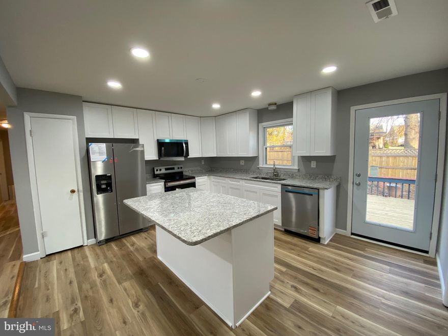 Please notice this is the one level section for lease.  3 bedrooms and 2 full baths. New Kitchen with granite counter tops and stainless steel appliances. New HVAC. New paint all over. New Luxury Vinyl Plank floor all over. One New bathrooms and the other one will be totally cleaned. Large living room and huge family room. Huge deck in the back. Owner agent