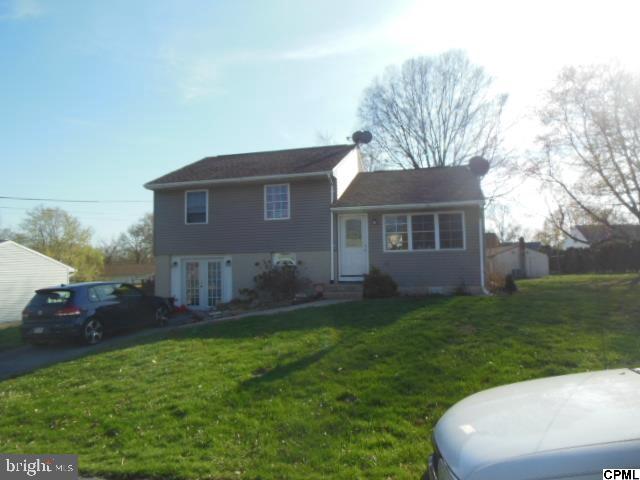 Split level home with 3 bedrooms and 1 full bath. Off street parking. Patio in rear of home. Living room with fireplace. Open kitchen with kitchen island. Bathrooms has a custom tiled shower with bench. Lower level family room with exterior entrance. Show and sell! Great investment property!