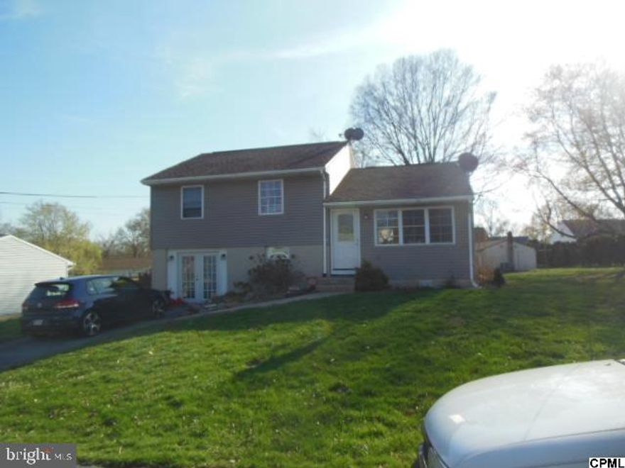 Split level home with 3 bedrooms and 1 full bath. Off street parking. Patio in rear of home. Living room with fireplace. Open kitchen with kitchen island. Bathrooms has a custom tiled shower with bench. Lower level family room with exterior entrance. Show and sell! Great investment property!