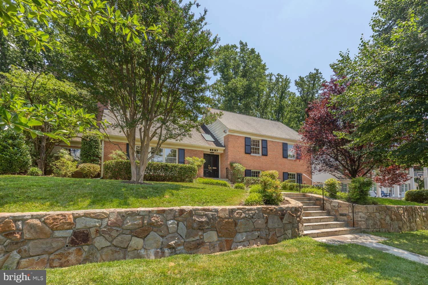 ** Open House Saturday 6/28, 2:00-4:00pm and Sunday 6/29 2:00-4:00pm**
This beautifully updated home offers 4 bedrooms and 3 full baths across nearly 2,900sqft, creating the perfect blend of comfort, flexibility, and charm in Bethesda's sought-after Kenwood Park neighborhood.
From the moment you step into the two-story entryway bathed in natural light thanks to a skylight, you’ll feel the openness and warmth that define this wonderful home. The main level features a large eat-in kitchen perfect for casual dining and conversation, sizable formal living and dining spaces for entertaining, and a versatile den, complete with its own cozy fireplace — perfect as a home office, lounge, or playroom. Additional highlights include generously-sized bedrooms, including the expansive primary suite with large closets and separate dressing area off full bath. A rare walk-up attic offering versatility as a guest room, office, or teen retreat. The lower level family room has additional fireplace, laundry and guest room.
Head outside to private backyard oasis, surrounded by lush landscaping and custom-built patio for those gorgeous warm-weather days and meals al fresco! The upper lawn is an ideal play space, offering plenty of room for activities and outdoor fun on this multi-tiered yard. Storage is plentiful with an attached two-car garage, offering both convenience and extra room for bikes, tools, and more.
Tucked away on a quiet street in the Whitman cluster, you're just minutes to the Westbard Shopping Center, Whole Foods, Tatte, Bethesda Row, Metro, and easy access to DC and Virginia!