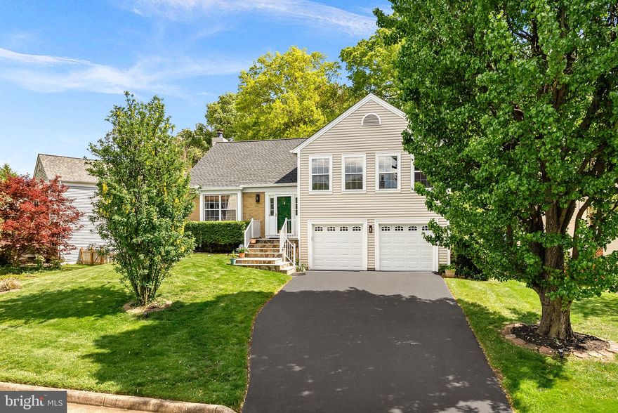 Move-in ready and beautifully updated, this home sits on a quiet street in Countryside with serene, tree-lined views. Step inside and take in the soaring vaulted ceilings and hardwood floors. The updated kitchen is a true standout, featuring custom cabinetry, granite countertops, and brand new stainless appliances. The spacious dining room features two skylights that flood the space with natural light. Just off the kitchen, a large covered deck overlooks mature trees and a common area, offering the kind of privacy that is hard to come by. The fully fenced backyard rounds out a wonderful outdoor space.  The upper level has three bedrooms, including a comfortable primary suite with a beautifully appointed private bath and two closets. The remaining two bedrooms share a beautifully updated hall bath. Head downstairs to find a versatile lower level complete with a second living room, a built-in wet bar with beverage fridge and cabinetry, fireplace, a full bath, laundry room with utility sink, and a fourth bedroom that works equally well as a home office.  The walk-out lower level opens to the backyard and a covered patio for additional outdoor living. A large storage area and a two-car garage complete the layout. The exterior details do not disappoint. Upgraded stone steps and a freshly sealed driveway add great curb appeal, and the big-ticket items are already done: new roof (2025), new kitchen appliances (2025), and new garage doors (2024).
Countryside is located just off Rt. 7 and Rt. 28, with Dulles International Airport about 15 minutes away. An abundance of shopping, dining, and entertainment are all within minutes, and the neighborhood offers miles of trails, three outdoor pools, a catch-and-release pond, and basketball, tennis, and pickleball courts.
Move-in ready, ideally located, and priced to sell. Schedule your showing today!