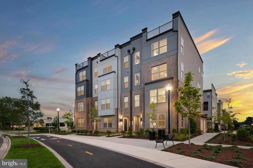 Welcome to The Julianne, a spacious 2-level townhome-style condo designed to offer the perfect blend of style, comfort, and functionality. This homesite with 3 bedrooms, 2 full bathrooms, and 1 half bath, offers over 2,400 sq. ft. of thoughtfully designed living space, ideal for both relaxation and entertaining. The heart of the home is the stunning kitchen, featuring modern finishes, an expansive island with bar seating, and a sizeable walk-in pantry for ample storage. It seamlessly connects to the open-concept living and dining areas, making it perfect for gatherings or quiet evenings at home. The oversized dining area flows effortlessly onto your private covered patio, creating an ideal space for hosting family and friends or unwinding while enjoying picturesque neighborhood views. The main level also boasts a private home office, perfect for telecommuting or setting up your creative workspace, offering a quiet and productive environment. On the ground level, you’ll find a 1-car garage with extra storage, and with a driveway that accommodates additional parking, convenience is truly at your fingertips. Upstairs, the primary suite offers a peaceful retreat with a large walk-in closet and an en-suite bathroom, providing the perfect place to relax and recharge. Two additional bedrooms and a conveniently located laundry room round out the upper level, ensuring practicality and comfort for the whole family. Living at Park Place means more than just a home; it’s a lifestyle. Enjoy a prime location with easy access to the Innovation Metro Station (Silver Line) and the upcoming Rivana Town Center, just steps away. Dulles International Airport is only 2 miles from your front door, offering the ultimate convenience for those on the go. Experience a home designed to complement your dynamic lifestyle. Discover The Tessa today! *Photos are of a similar model home