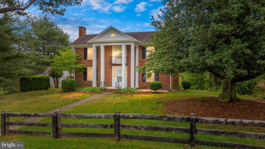 Historic 1875 Brick Manor on Premier Horse Farm with Barns, Pastures & Scenic Setting. Step back in time with this stunning Civil War-era brick manor home, built in 1875 and nestled on a beautiful horse farm. Offering just over 2,500 sq ft of vintage charm, this 3-bedroom, 2-bath residence boasts a traditional floorplan with multiple sunrooms, two cozy fireplaces, and timeless architectural details throughout.

The property is a dream for equestrian lovers, featuring an array of functional structures including a center aisle stable, pony barn, hay barn, equipment shed, run-in sheds, riding ring and a classic chicken coop. The lush, fully fenced pastures—currently in hay production—are divided into multiple fields and paddocks, all enhanced by a peaceful pond and a gentle creek that flows on the border. This property could easily be a producing farm or homestead as well.  A detached, oversized 4-car garage adds convenience and utility with room for tools and shop area. 

This farm is perfectly located beside large, picturesque estates, offering both privacy and a sense of community in a highly desirable setting. Whether you’re seeking a working farm, a private countryside retreat, or a piece of American history, this unique property offers it all.