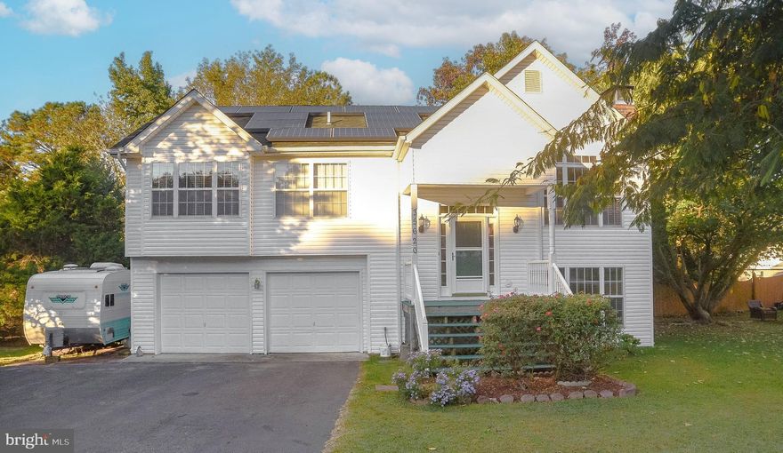 Located in the community of Wicomico Shores.  With its delightful features and enticing surroundings, this home has so much to offer ! As you enter the main level, be greeted by the warm embrace of laminate floors that invite you to explore further.  The expansive primary bedroom offers a walk-in closet, ensuring you have plenty of space. The  living room perfect for relaxation and entertaining while the warmth of the wood insert warming the entire home.  Enjoy the basement entertainment room  and to  completing the picture is a full bath, providing convenience and comfort for all. The atmosphere cool and refreshing, adding a touch of luxury to your everyday living.