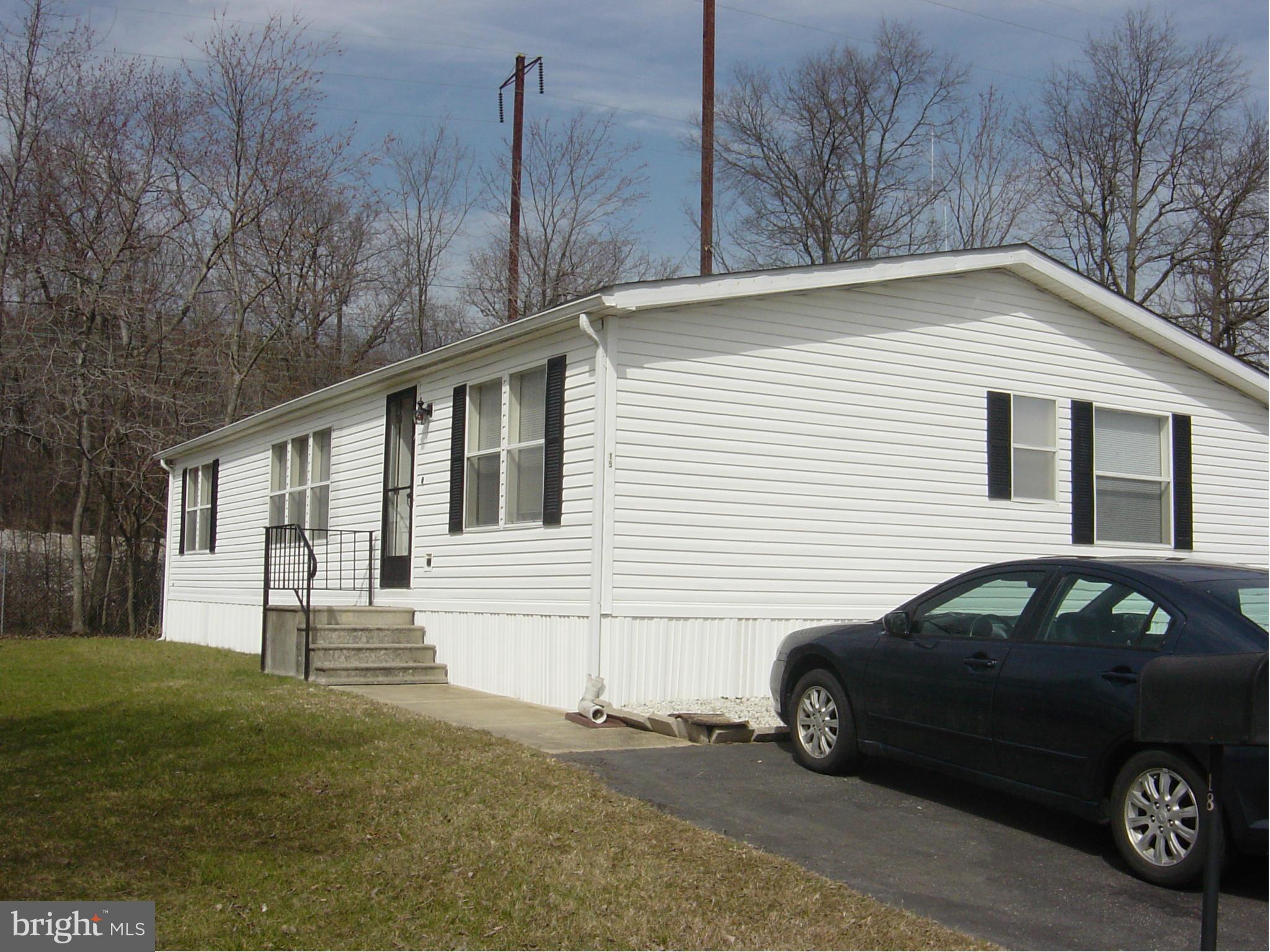 Priced to sell. Large 3 BR, 2 bath double wide in the Peppermint Woods Community. New wall/wall carpet in LR, hallway and 3 BR's. Master BR with attached master bath. Master bath has soaking tub and separate shower. Sliding glass doors off DR to deck. Kitchen with plenty of cabinet space. Ground rent $656.00. Approval necessary from park. Community doggie park, fitness center and playground.