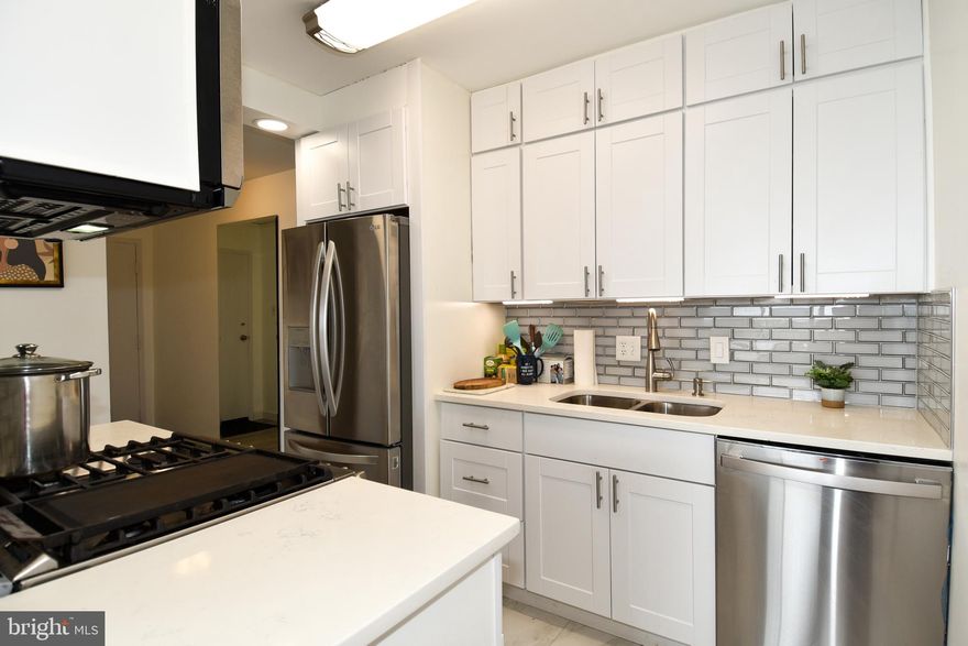 This is a unique corner 1 bed 1 bath with a great view!  Spacious floor plan with balcony. Completely renovated including flooring, lightlig, appliances, counter tops, backsplash, bath tub/shower, vanity, fresh paint and more! The kitchen has a french door refrigerator with ice maker, double sink, microwave, double oven, tile backsplash, white cabinetry and new flooring. The bathroom features a glass sliding door on the tub/shower. All new custom tile, with recessed shower niche, new  mirror with storage and new vanity. Must see! Basement storage area with individual enclosed storage unit (#820). Community amenities Pool, Gym, Sauna, Yoga room, Secure access Lobby with Concierge, Walking Trails, Gardens, and much more plus 24 hour desk All Utilities Included. **Please verify the condo fees and rules**