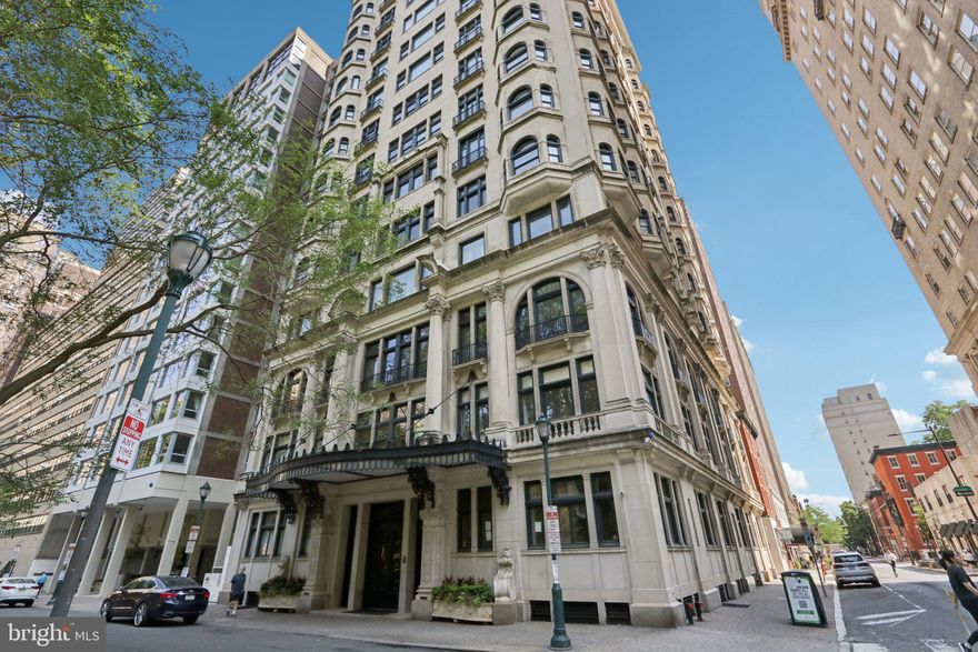 How do you know you’ve arrived? You’d live in one of Philadelphia’s most elegant buildings, situated on Rittenhouse Square Park without having to compromise your desire for an abundance of beautiful living space.
To create this opportunity, 2 separate units have been enjoined to create the 2,200+ stunning square foot living space in this exquisite and iconic Beaux Arts style building. This architectural masterpiece features intricate stone carvings, balustrades, Juliet balconies, arched windows, ornate iron work and the crown jewel, the iconic glass and iron marquis and doors. This is where impeccable service begins.  From the moment you approach,  the door is opened for you and the staff stands ready to assist with packages. As you walk through the grand lobby, enveloped by coffered and gilded ceilings, Tiffany chandeliers, and marble floors the elevator operator greets you and ushers you your floor. 
The elegant foyer with gleaming marble floors and intricate millwork greets you and leads you into your expansive space as sunlight pours through large windows and Juliet balconies, highlighting the soaring ceilings, crown moldings and parquet floors.
The open Dining and Living Room features a wonderful wide-open space with built in bookcases and recessed lighting. The Dining Area feat. the perfect niche created by a bay of windows for you and your dining guests to enjoy a meal prepared in your adjacent, classic black and white tiled Kitchen feat. a gas Thermador Range, Carrera marble countertops, plenty of cabinetry, and closets too! The exquisite Main Bedroom features two full bay window alcoves, prefect for seating, dressing or just enjoying the view. A walk-in closet and a classic Ensuite Main Bath with wall-to-wall glass shower, vanity with marble top and designer lighting make this truly a suite. The Study/ 2nd Bedroom features 2 closets, amazing views and light captured by the oversized windows and doors including a Juliette balcony.  
The second full bathroom feat. tiled floor, tub shower and pedestal sink. 
The Family Room, located at the corner of the building features more amazing views from the wall of windows, a sitting area, an open gathering area, Juliette balcony, and ample built in custom shelving. The Craft Room/Laundry Room. Here you will find open space with a beautiful free standing porcelain sink, built ins and the washer and dryer. This space could potentially be additional small kitchen or full bath to service the current Family Room, or as part of a suite for an au Pair, caregiver, boomerang child or parent There’s even a separate entrance door from the foyer that could be utilized for more privacy, should you wish for this to become separate living quarters.
These spaces are designed to function for however you decide whether it be elegant entertaining, working from home, a more informal retreat or working on your next project in the craft room. 
There are amenities too, including a Gym, Bike Room and a full-service Mail Room. The staff will collect your mail and packages and deliver them to your door and will even send you a text message to let you know your package arrived! Just outside the front door is the lovely Rittenhouse Square Park where Black-Tie galas, art shows, picnics, children playing and dog walking are a common site. Fine and casual dining, coffee bars, the new Equinox gym and plenty of boutique shops are just outside your front door. When you’ve finished your day, you can come home where the doorman is waiting to greet you, its “library” quiet and ascend to your quiet oasis, high above it all. Yes, you have arrived.


 An allowance  for 1 year of parking to be given to the buyer from the seller with an acceptable agreement of sale.
