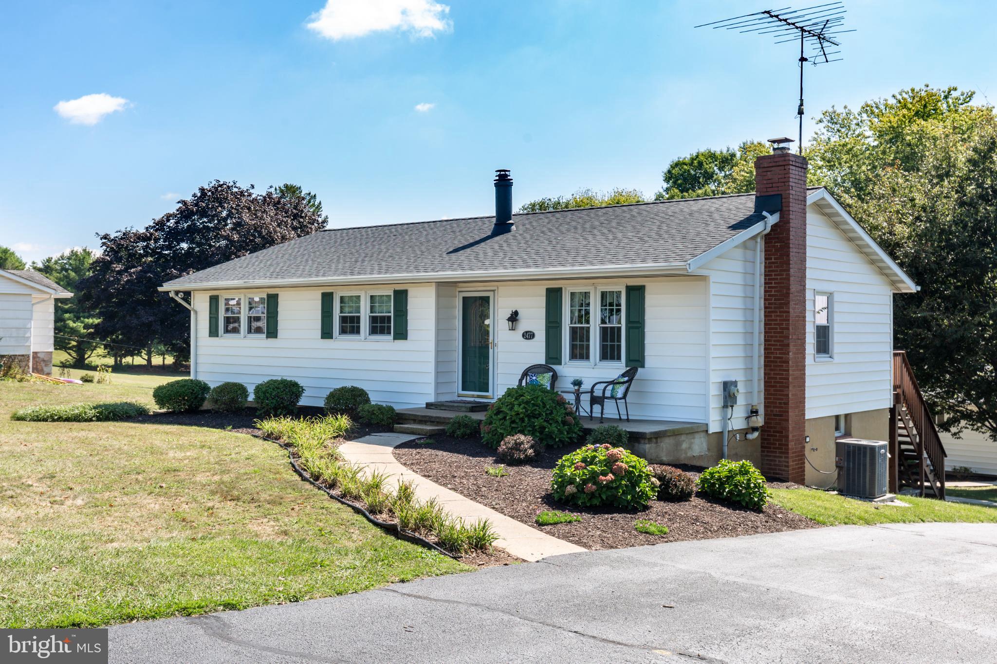 This charming 3-bedroom, 1 full and 2 half-bath rancher sits on a peaceful 0.59-acre lot in rural Carroll County. Built in 1975, the home has been lovingly maintained and thoughtfully updated with key improvements, including a new roof on both the house and detached garage (August 2025, GAF Lifetime Timberline HDZ shingles), water heater (Sept 2025), HVAC system (2017), water neutralizer (2023), stove and dishwasher (2024), flooring in kitchen (2024) and dryer (2025) - offering peace of mind for years to come.
Step inside to discover a warm and welcoming interior featuring beautiful wood floors that flow throughout the main living areas. The traditional floor plan includes a cozy living space with a wood-burning fireplace, perfect for taking the chill off on those cool evenings. The combination kitchen and dining area is designed for both casual meals and entertaining, equipped with modern appliances including a dishwasher, microwave, and stove, ensuring meal prep a breeze.
This home boasts three spacious bedrooms, including a primary suite features a walk-in closet and half bath. Two additional generous size bedrooms and a full hall bathroom complete this level, morning routines will be seamless for everyone. The partially finished basement adds valuable living space and includes a walkout rear entrance, making it ideal for a family room, home office, playroom, or additional storage. The laundry area with half bath is conveniently located in the basement, equipped with a washer and dryer for your convenience.
Outside, the property shines with its expansive rear yard, perfect for outdoor activities, gardening, or simply enjoying the scenic vistas of the surrounding pasture. An oversized detached garage with electric provides ample space for vehicles and hobbies with 2 additional sheds both with electric for addtional storage. Enjoy the tranquility of rural living while being just a short drive from local amenities. This home is not in a development, offering a sense of privacy and space that is hard to find. Whether you're sipping coffee on the expansive rear deck or hosting a barbecue in the backyard on the patio, this property is designed for making memories. With its inviting features and serene surroundings, this home is ready to welcome you. Don't miss the opportunity to make it your own!