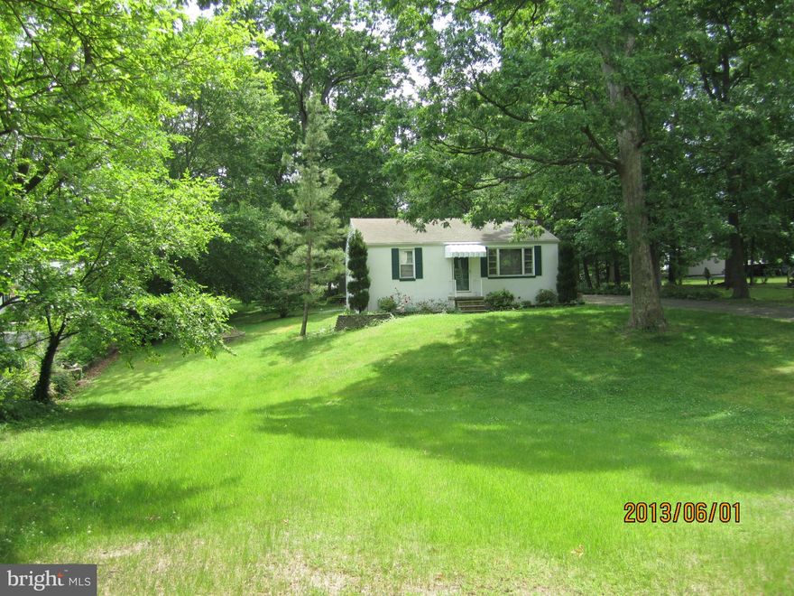 Cottage 2 BD 1BA with Fireplace. Ceramic Bath with jetted tub, Updated Kitchen, Hardwood Floors. Full Basement Unfinished. Beautiful Large Lot with Mature Trees.  Located in Water Oriented Community walking distance to Essex Marina, Hilltop Marina and Snug Harbor Marina