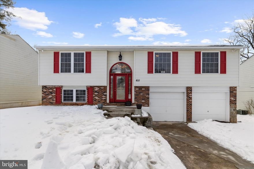 Welcome to 611 Bond Avenue! Step through the magnificent front door with transom into your renovated home. Hardwood steps and rod iron railings bring you to the first level. Moving upstairs you will find yourself in the stunning living room with rich hardwood floors, crown molding and tons of natural light. The gourmet kitchen showcases premium granite counters, a center island with breakfast bar, modern stainless appliances and dark shaker cabinetry. All cabinets and drawers feature soft close hinges. The kitchen opens to the living room and dining room. Off the dining room, the home features a 16x30  Trex deck with outside stairs to the yard.  Down the hallway, you will find the renovated hall bathroom with porcelain tile shower and a rainforest showerhead.  As you enter the primary bedroom, you will find a large double-door closet, plenty of natural light again and a renovated private bathroom with a stunning spa-inspired shower. The shower features dual showerheads, body jets and built in shelves. The doors are all updated 6 panel, high baseboard trim, and updated molding around the doorways. Making your way downstairs, the lower level is a true standout with the hardwood floors again! It features a cozy family room with recessed lighting anchored by a custom wet bar and a matching natural, live-edge chestnut built-in shelf, a craftsman’s touch that brings warmth and style to the space. Below the deck, you will find another large space with a patio. Don't forget to take note of the backyard space! It is fully fenced with white vinyl making the space is ideal for entertaining BBQs throughout the Summer or firepits in the Winter!  Finally, this property features an oversized two-car garage, making it perfect for extra storage, workshop space, or keeping vehicles protected year-round. Windows, roof, siding, as well as lighting fixtures, bathrooms and flooring have all been updated in the last 9-10 years.  This  home is perfectly positioned just a few miles from Stevenson University and mere minutes from the highway, shopping and dining. While the home awaits your personal updates, its solid bones and unbeatable location make it a standout choice for savvy buyers. Close to everything you need, with the potential to be everything you want!