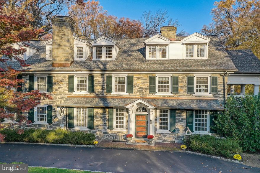 Nestled in a beautiful tree lined quiet street and a short walking distance to Suburban Square, this updated Fieldstone home offers old time elegance and modern amenities. This gracious home on over an acre is in the award winning Lower Merion School District in Northside Ardmore. This 5+ bedroom home with almost 6000 square feet is both elegant and welcoming. It is the perfect place for entertaining like Martha Stewart. The Formal Dining Room and Formal Living Room with French doors lead to a covered porch overlooking your serene gardens and Har-Tru tennis court. First and second floor libraries ensure that you sit, and relax
with a good book. The covered balcony off the Primary bedroom with its lattice railings and pillars allow you to drink your morning coffee in peace. Three additional bedrooms and two other bathrooms allow you to have guests, and still enjoy your privacy. The third floor has a children’s playroom, homework room, exercise area , and a pool table for entertainment. Additionally, there is a private home office/Nanny suite with a full bathroom.
This stunning Main Line Beauty affords a wonderful lifestyle. With the feeling of being in the
country, while being less than a five minute walk to the trendy boutiques, delicious eateries, and
the popular Lifetime Fitness Center in Suburban Square. This beautiful home is just a 20 minute
drive to Center City or you can hop on the R-5 train. If you love Broadway you can even get a
train from Ardmore to New York. Don’t miss the chance to make this Once-in-a-Lifetime house
your home, and experience the epitome of comfortable stylish living, and enjoyment.