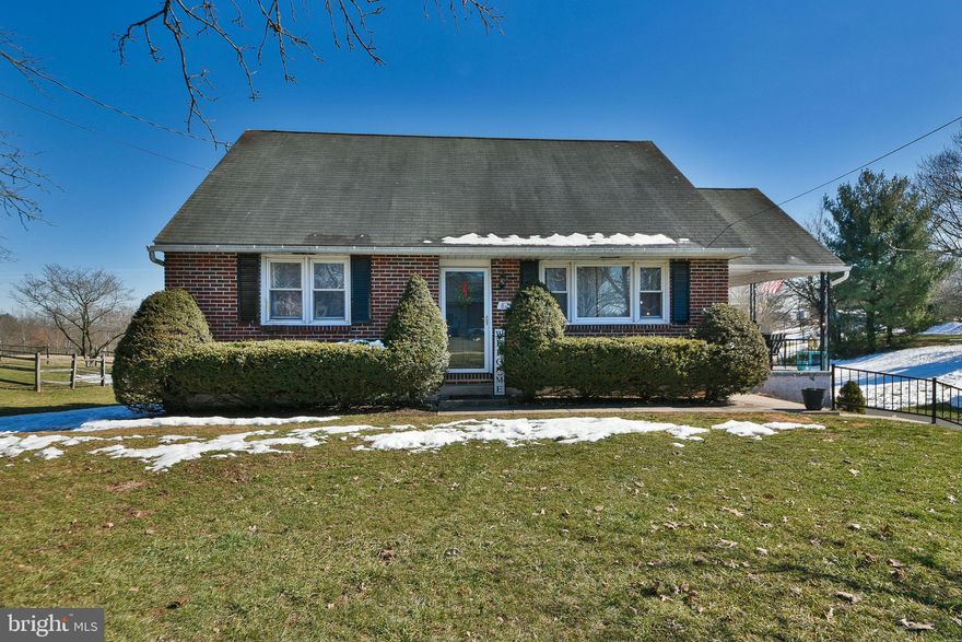 This lovely brick Cape Cod style home is move in ready.  The living room has hardwood flooring, along with   a built in electric fireplace with a remote that changes colors, so you can set the theme for game time. The updated eat in  kitchen is bright with white cabinets. There is ample counter space that is complimented by the updated backsplash.  The laminate
flooring  makes for ease in clean up. Opening off the kitchen is a large covered deck. This spacious area gives you plenty of space for entertaining or just relaxing and taking in the lovely country-side view off the back. The hall bath has been remodeled. It offers a stunning vanity and full tile shower/bath combo. The hardwood
flooring extends down the hallway and into the bedrooms. The primary bedroom is inviting. It is large enough to fit a king sized bed . The second bedroom is a nice size with good closet space. The hardwood stairs lead up to the second floor from the living room. It is ready for all your ideas. A primary suite with  a spa bath or perhaps two bedrooms and a bath. The large walkout basement is another area that can be finished. There is a working toilet and sink. Along with a open shower that would work well as a pet clean up station. There is a door to the attached two car garage. It is heated and has openers for both. The large lot allows for plenty of parking and retreat space but also close to major roadways.  Make your appointment today and call this home.