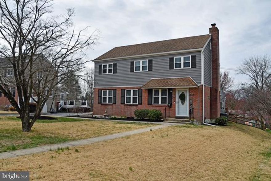Welcome Home! This stunning three bedroom home is located in the heart of Springfield Township. As you enter the house into the living room, which is adorned with hardwood flooring, fireplace and plenty of natural sun light. Next to the living room is the dining room with recess lighting which flows directly into the large, beautiful, updated kitchen. The kitchen contains a large island with granite countertops, large pantry cabinet, coffee station area and updated appliances, just perfect for cooking and entertaining with family and friends. The extra large family room next to the kitchen is perfect for family movie nights. It has a side door access from driveway, full bathroom and sliding glass doors that  lead to a wrap around deck with steps that lead to large fenced in backyard.  Upstairs contains three large bedrooms with walk in closets and a full bathroom. The finished basement contains a room perfect for play area or office space along with a laundry room with newer washer and dryer and lots of storage space. There is also a small workshop area. Located near plenty of shopping and dining. Easy access to all major highways.  Make your appointment today!
