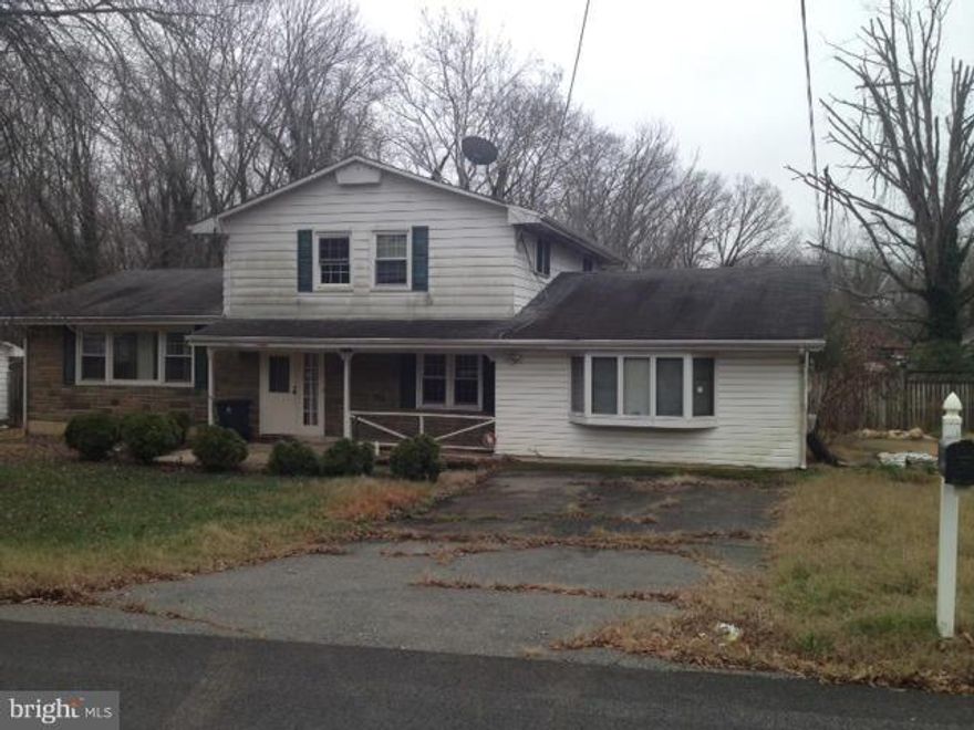 4 Level Split...Huge Family Room addition with bay window, recessed lights and large fireplace.  Covered patio.  Perfect house for entertaining.