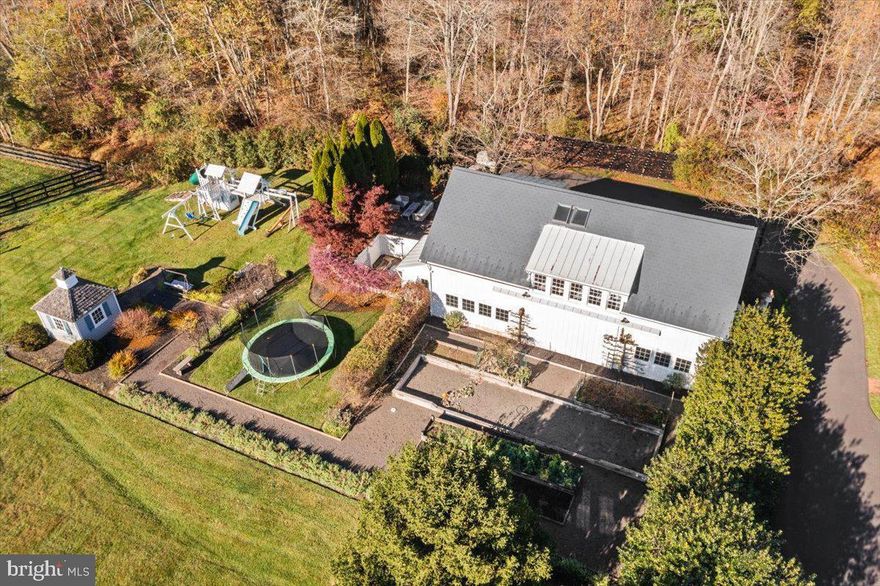 Set on a sprawling 8-acre estate is this two bedroom, two full and one-half bath carriage house that sits over a 3-car garage/workspace. The carriage house is fully furnished and can be the ideal space for those that may require the combination of a hobby, artistic or other storage/workspace with a separate, beautifully appointed living space. The main level offers more than 800 square feet of heated garage and working area.  The second level features a vaulted great room consisting of a spacious sitting area, kitchen and dining area.  Two bedrooms each with an en-suite bathroom and ample closet space provide a cozy retreat. A  separate laundry area is also available on this level.   Access to grounds and private patio. Utilities included. With gorgeous views of prime Bucks County farms and rolling hills, feel inspired by this wonderful setting.  For those that seek a quiet, private atmosphere but a quick drive to shopping, restaurants and commuter routes, this property has it all.