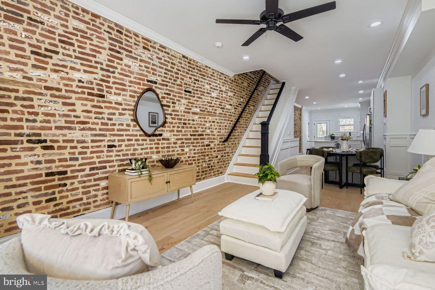 This gorgeous home has it all! 4 bedroom, 3.5 bath newly rehabbed Canton townhome with 10 year CHAP tax credits pending final, Rooftop deck, primary bedroom Trex  deck  and PARKING! This stunning home features a one year builder's warranty. You have to see this one. Original vestibule with French doors open to the open and spacious main level.  Picture frame wainscoting wall trim adds an attractive design statement to the living room and dining room. Exposed brick on both levels.  Gleaming hardwood floors, a gourmet kitchen with top-of-the-line stainless steel appliances. Quartz countertops and an oversized kitchen island complete with a wine/beverage fridge and microwave built in.  All energy efficient appliances.   Original stained glass, vestibule and transoms add original Baltimore character to the sleek and modern finishings. A half bath on the main level tucked discreetly behind the kitchen for your convenience.  Stairs to the Trex rooftop deck with stunning million dollar views are accessible from inside the upper level hallway. Full size washer and dryer conveniently located on the upper level. Each bedroom on the upper level has its own full bathroom.   The full basement has been dug out and underpinned affording 2 more bedrooms and another full bathroom. 1855 square ft of luxurious living space! Easy parking on the concrete pad out back. Centrally located - just a few blocks from Historic Patterson Park and Canton Square. Close to stadiums, hospitals, schools, Fells Point, shopping, restaurants, tunnels, major highways, all Baltimore attractions and entertainment. Save lots of $$ with CHAP tax credits...make your appointment today!