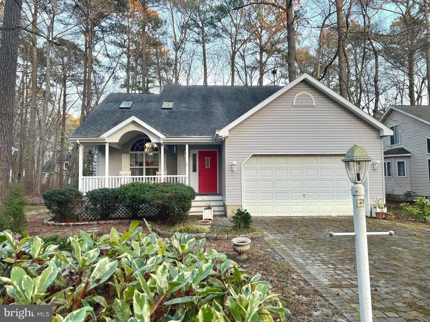 Welcome home to this Ocean Pines house featuring 3 bedrooms, 2 and a half baths, sunroom, 3 season room, loft and more! Beautifully updated kitchen with tall white cabinetry and blue pearl granite. Big bay window for table space. Skylights and large picture window for sunlight. High ceiling of living room is open to the loft above. Fireplace in sunroom. Main level primary bedroom with walk in closet and full bath beautifully updated and including grab bars. Separate laundry room. 2 car garage has utility sink and workshop space along with 2nd fridge/freezer. Crawl space is encapsulated. Sold mostly furnished. Terrific cul-de-sac location with front porch . Enjoy all that Ocean Pines has to offer and just minutes to the beach! This could be the best deal in town!